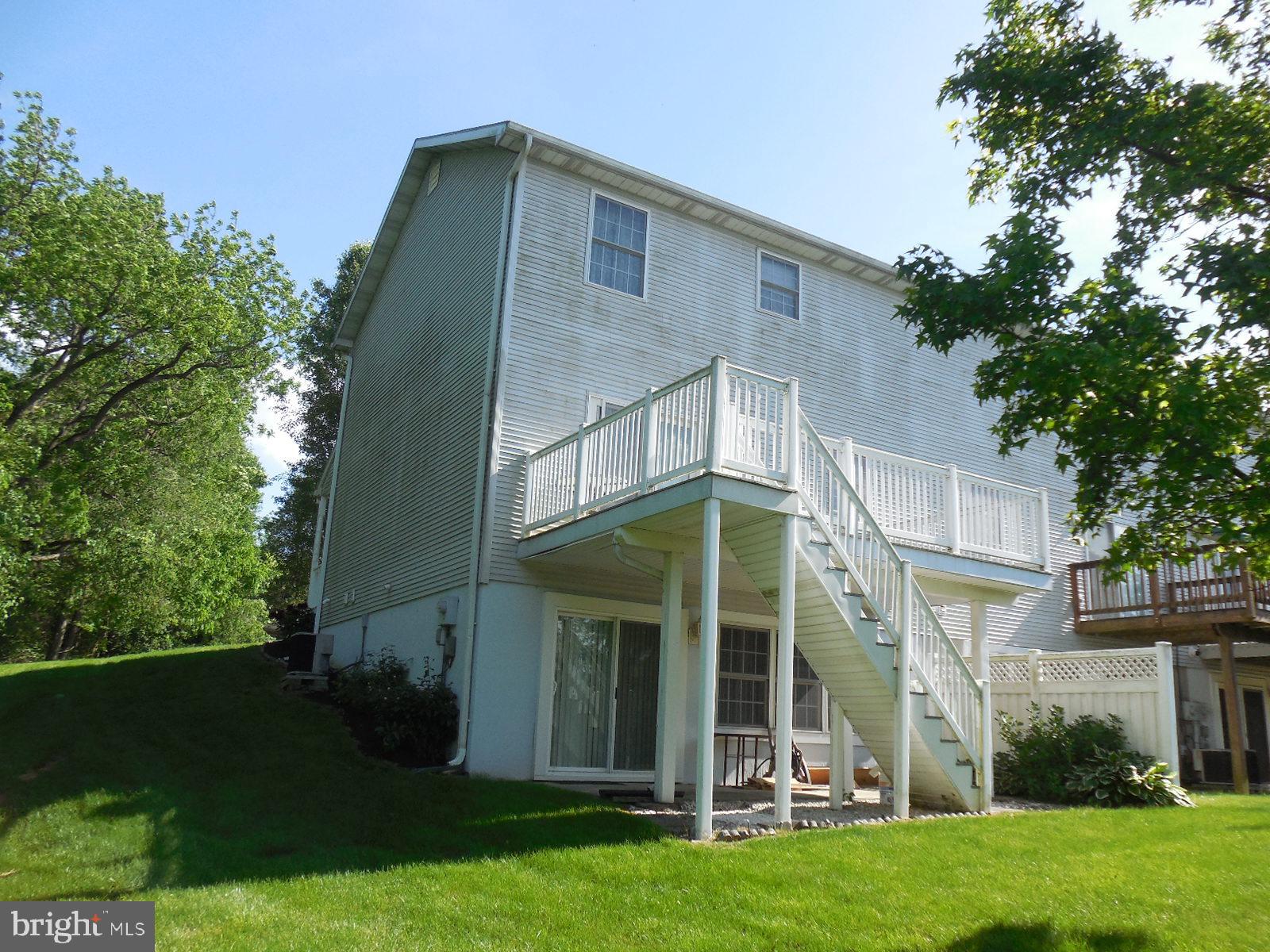 Walkout concrete, covered patio & beautiful deck