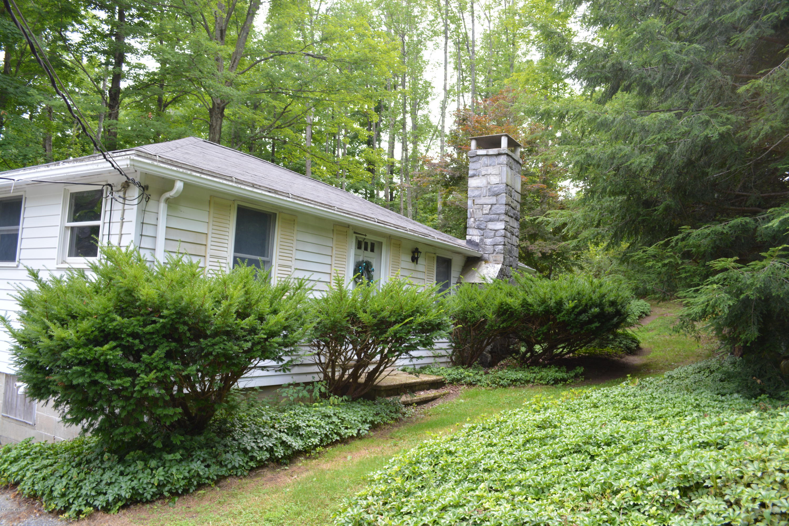 5 Dodd Road Sandisfield, MA 01255 - Photo 22 of 37 a view of a house with a yard and plants