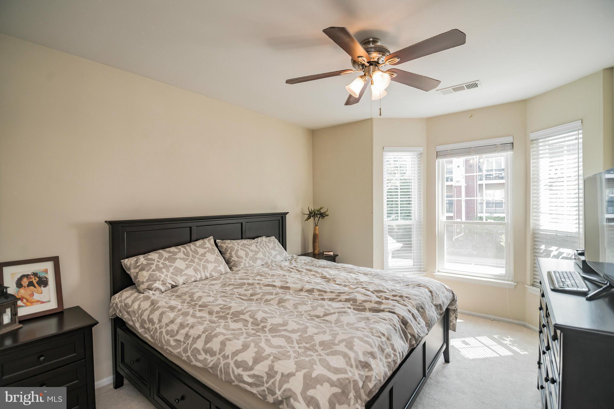 1600 Spring Gate Dr., Unit 2215 McLean, VA 22102 - Photo 18 of 30 a bedroom with a bed and window