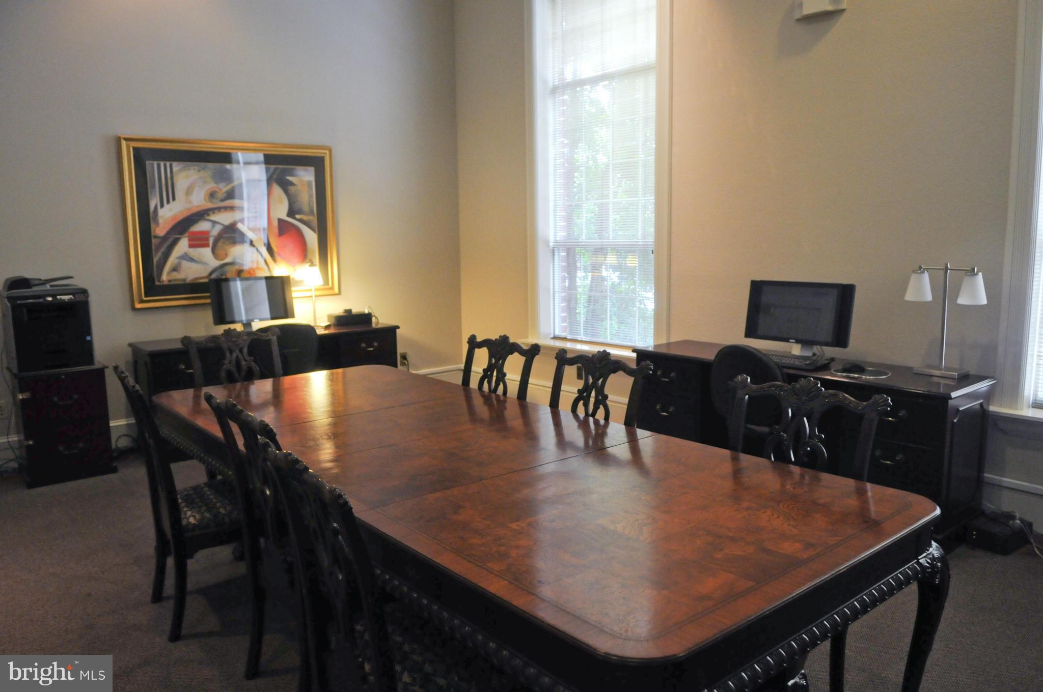 1600 Spring Gate Dr., Unit 2215 McLean, VA 22102 - Photo 27 of 30 a dining room with furniture and wooden floor