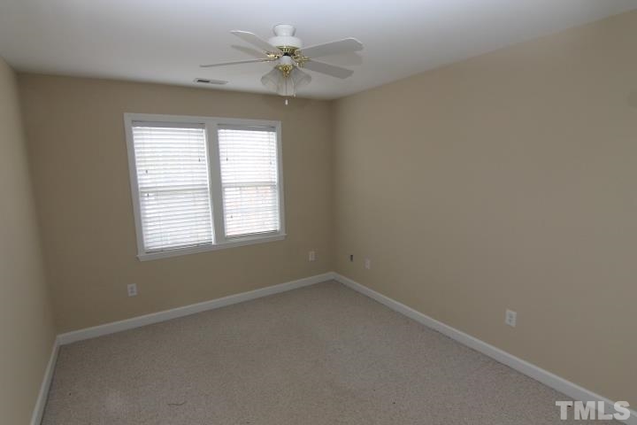 4900 Hunters Oak Trail Raleigh, NC 27616 - Photo 14 of 20 an empty room with a window