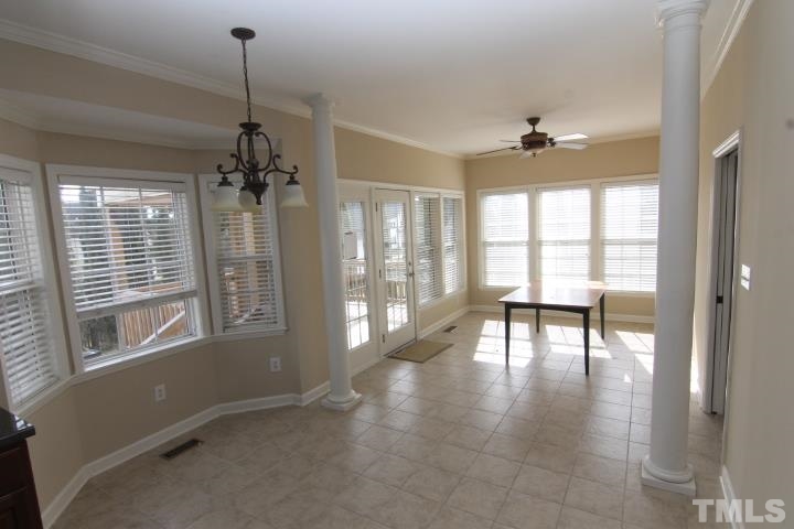 4900 Hunters Oak Trail Raleigh, NC 27616 - Photo 8 of 20 a view of a room with lots of windows and furniture
