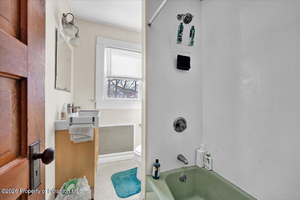 1026 Fairfield Street Scranton, PA 18509 - Photo 17 of 26 a bathroom with a tub and a sink