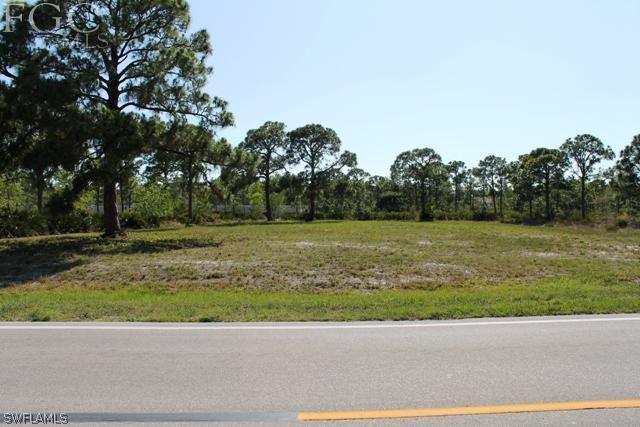 8511 Stringfellow Road St. James City, FL 33956 - Photo 1 of 13 a view of a garden with a building