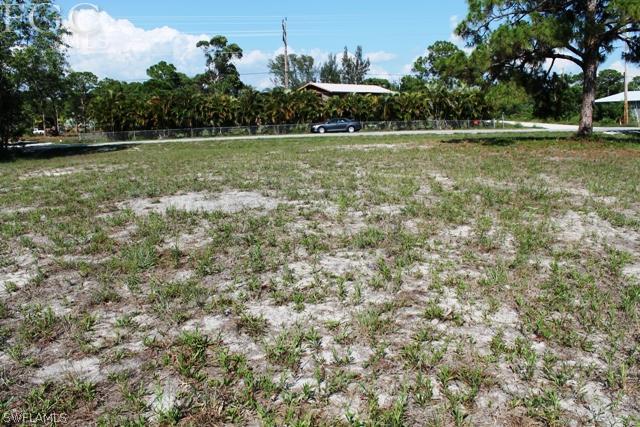 8511 Stringfellow Road St. James City, FL 33956 - Photo 3 of 13 a view of a green field