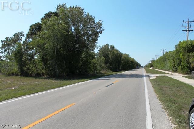 8511 Stringfellow Road St. James City, FL 33956 - Photo 9 of 13 a view of a field with trees in background