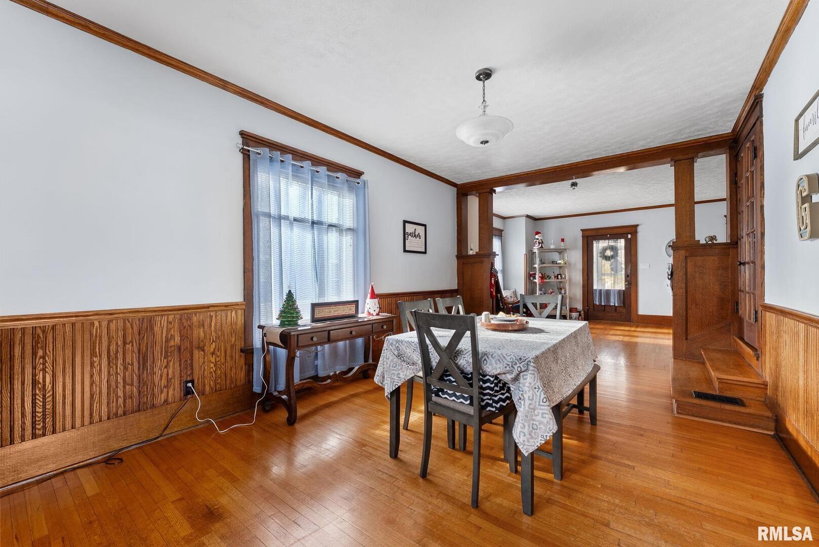 308 Northeast 3rd Avenue Aledo, IL 61231 - Photo 11 of 28 a view of a livingroom with furniture window and wooden floor