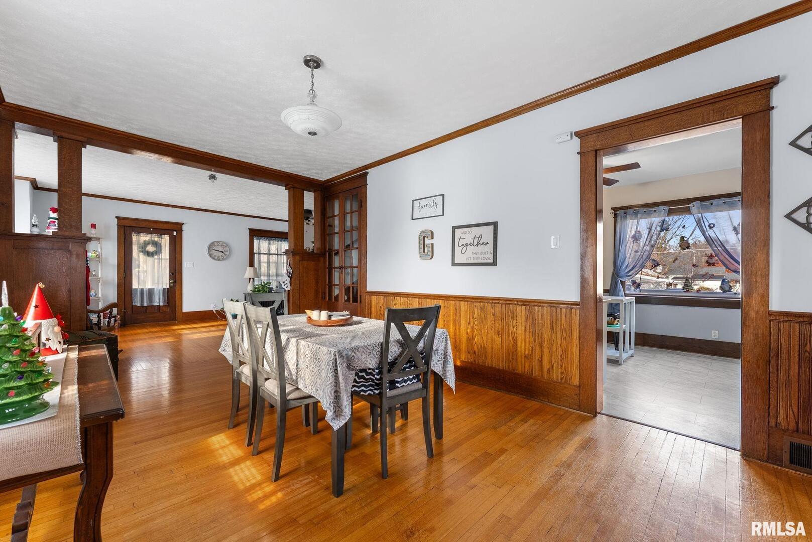 308 Northeast 3rd Avenue Aledo, IL 61231 - Photo 12 of 28 a view of a dining room with furniture window and wooden floor