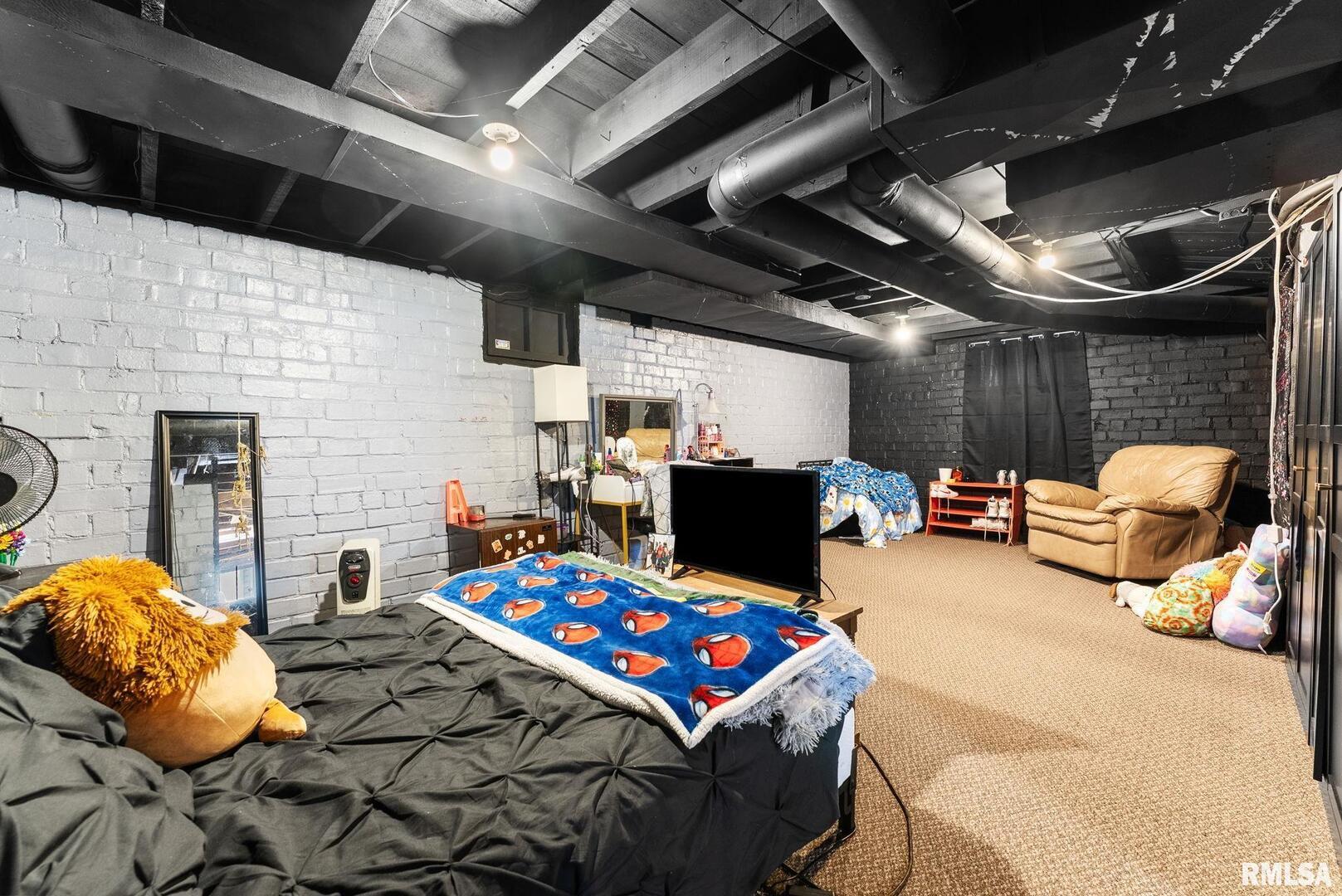 308 Northeast 3rd Avenue Aledo, IL 61231 - Photo 24 of 28 a bedroom with furniture and a fireplace