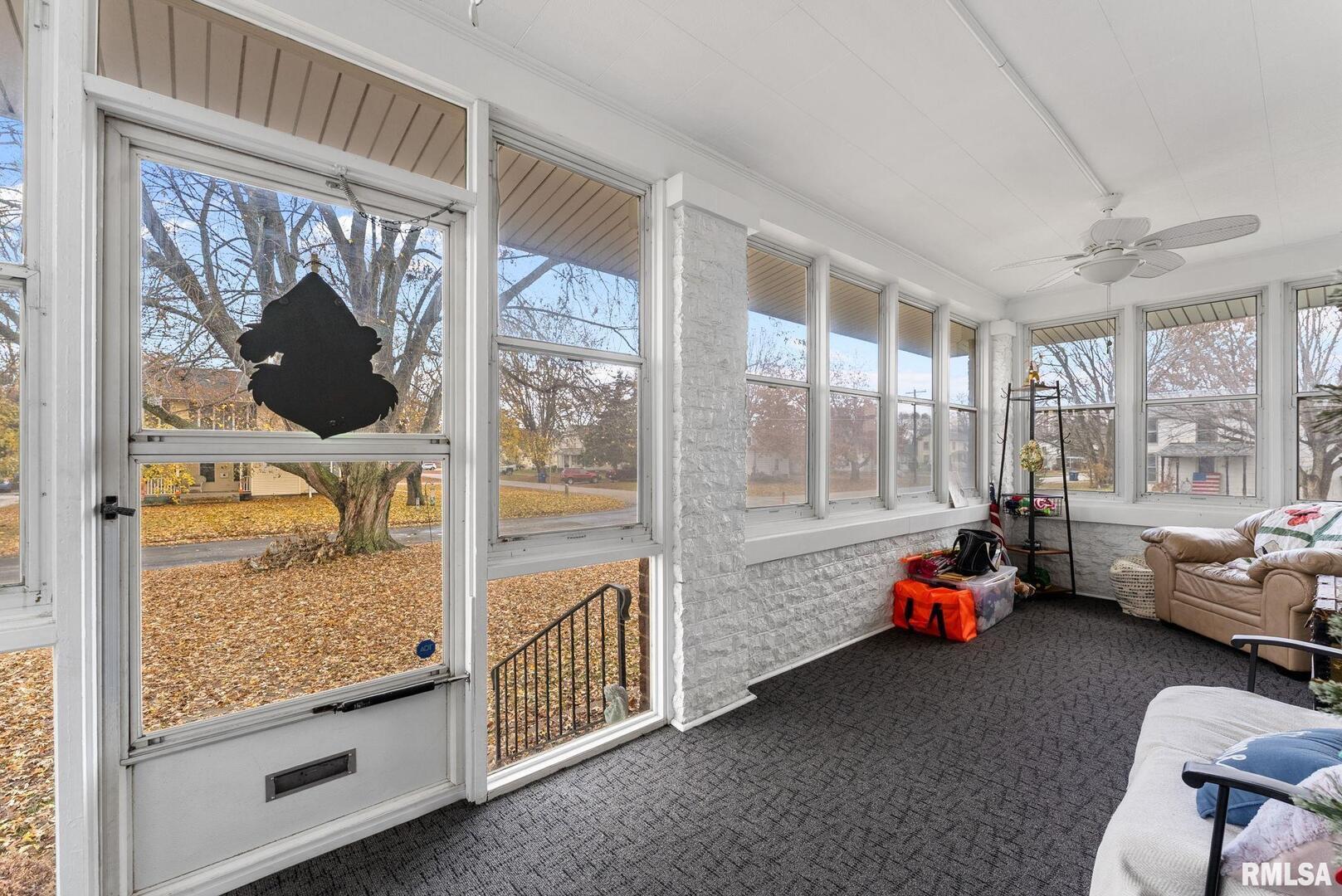 308 Northeast 3rd Avenue Aledo, IL 61231 - Photo 6 of 28 a view of living room with furniture and floor to ceiling window
