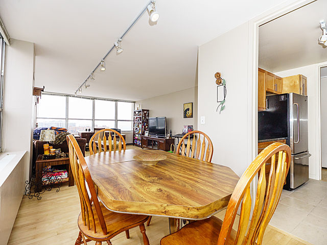 655 West Irving Park Road, Unit 2716 Chicago, IL 60613 - Photo 10 of 25 a dining room with furniture and entryway