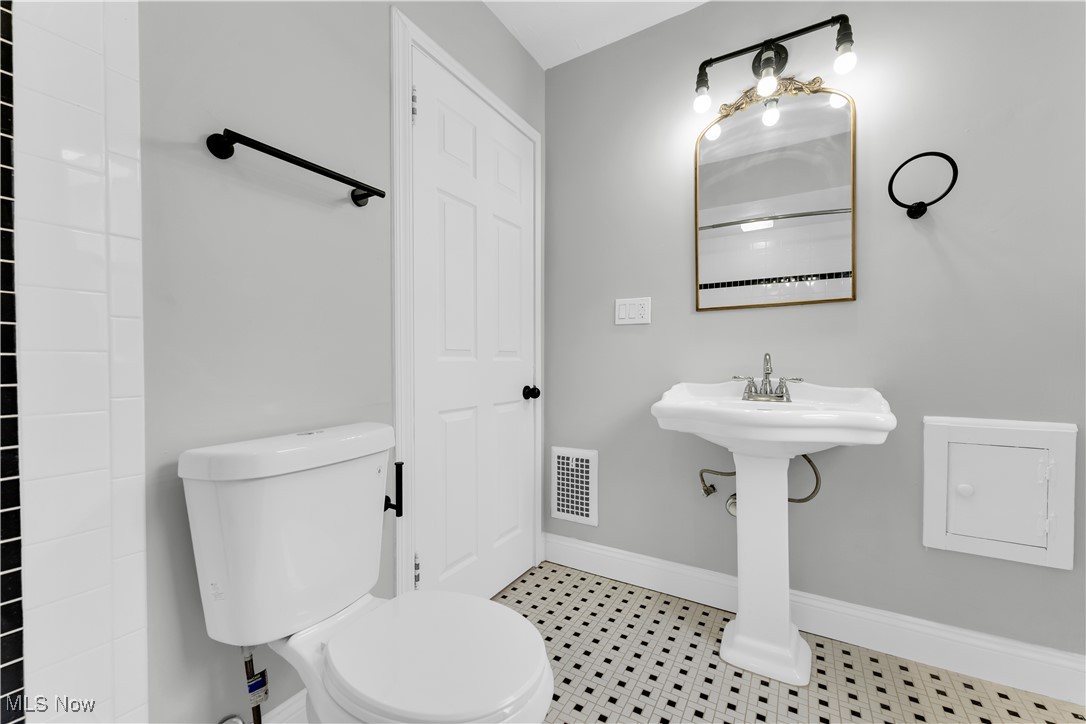 2593 Princeton Road Cleveland, OH 44118 - Photo 31 of 34 Bathroom featuring baseboards, visible vents, and toilet