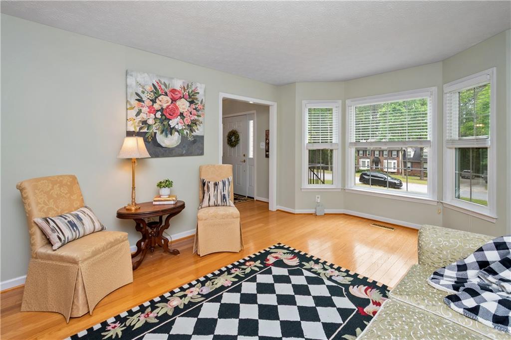 405 Ridgemont Drive Fayetteville, GA 30215 - Photo 2 of 43 a living room with furniture and a large window
