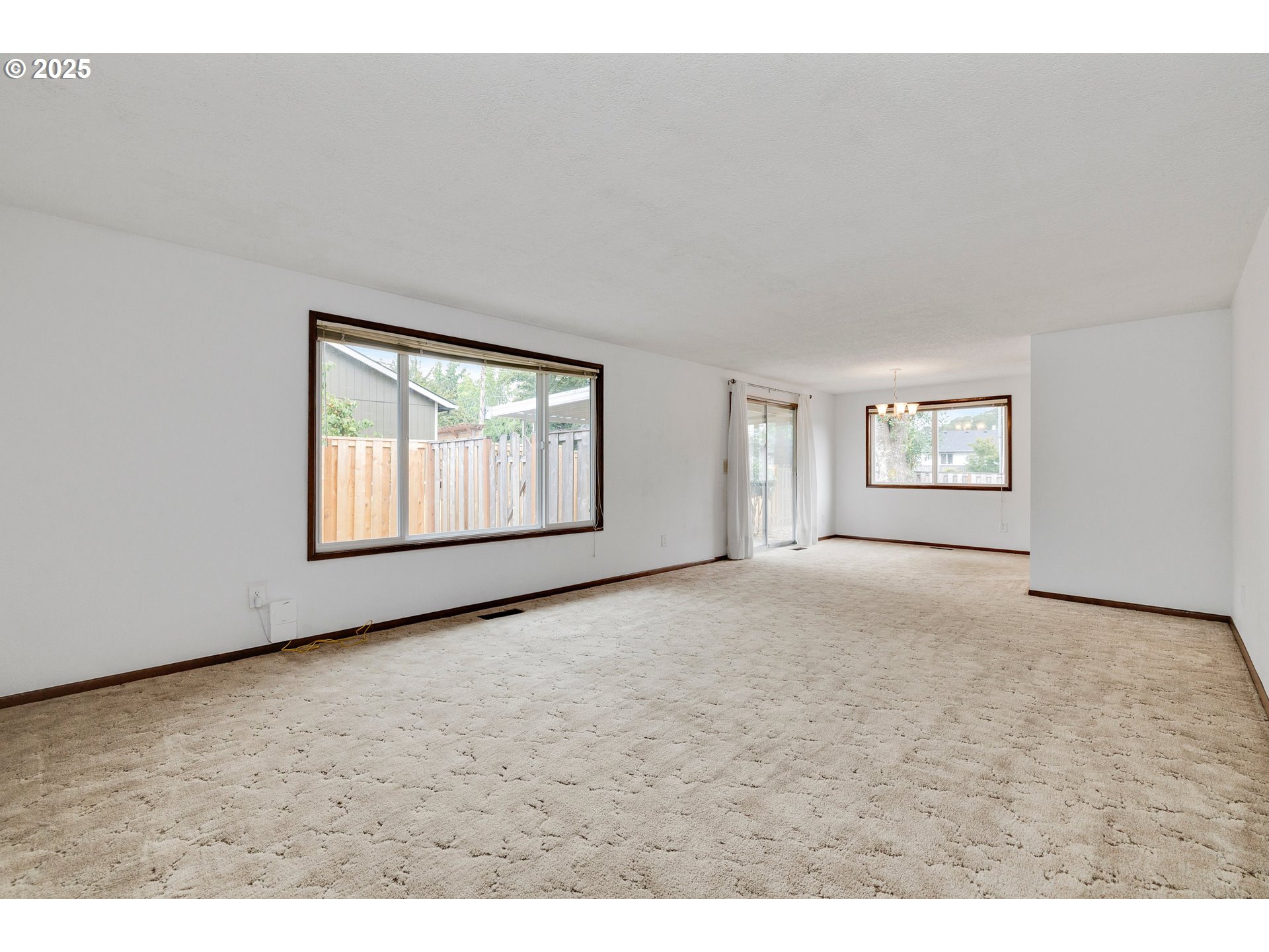 210 Forest Place Forest Grove, OR 97116 - Photo 15 of 35 a view of an empty room with windows