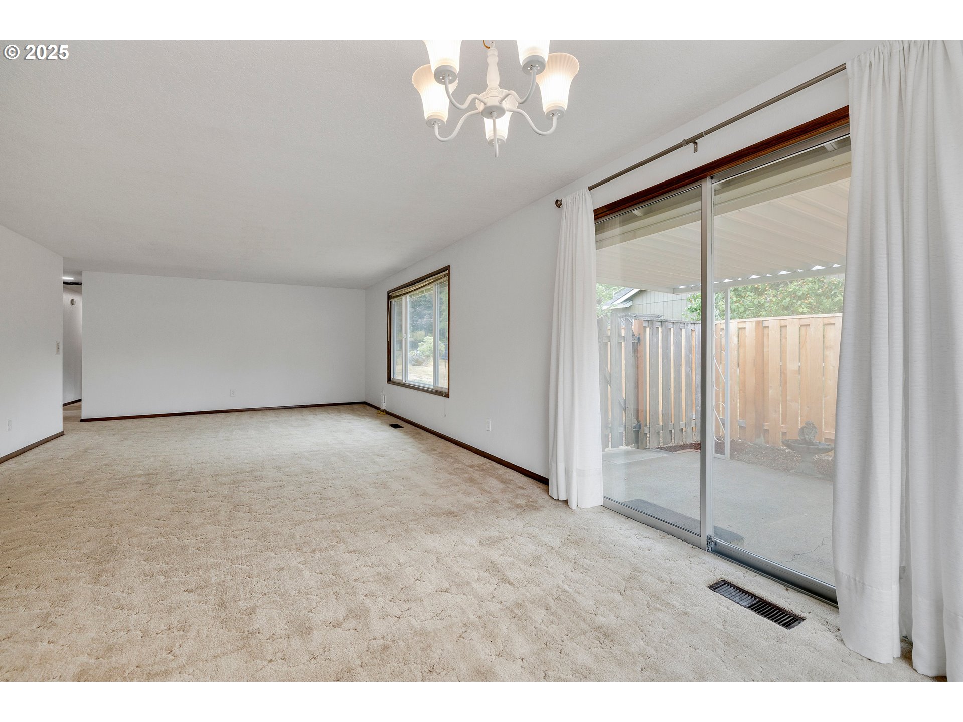 210 Forest Place Forest Grove, OR 97116 - Photo 17 of 35 a view of an empty room with a window