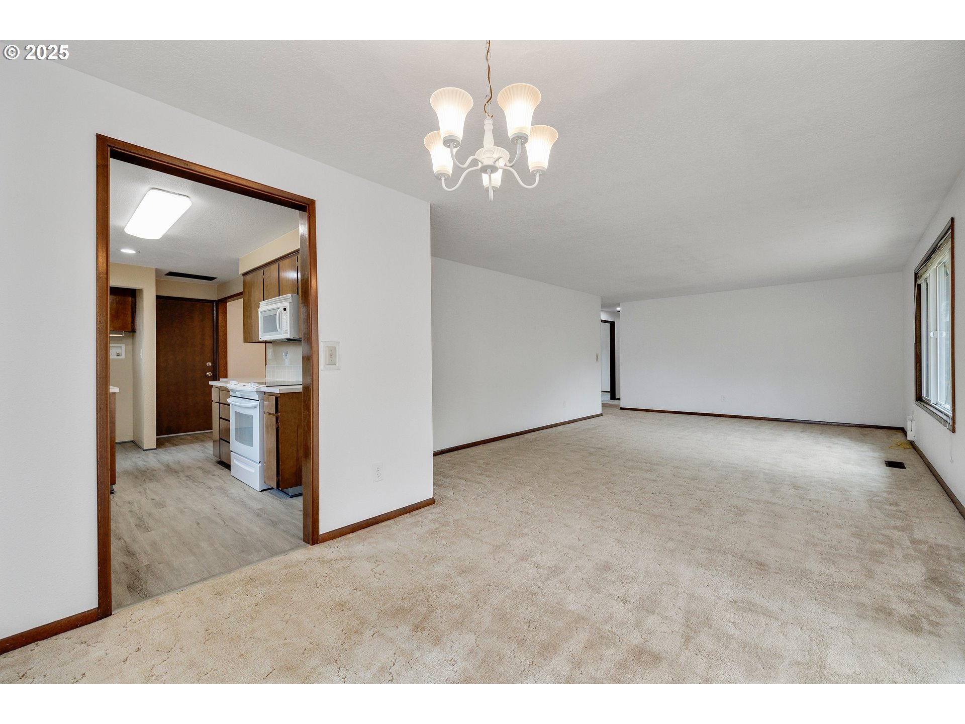 210 Forest Place Forest Grove, OR 97116 - Photo 20 of 35 a view of a big room with chandelier and a chandelier