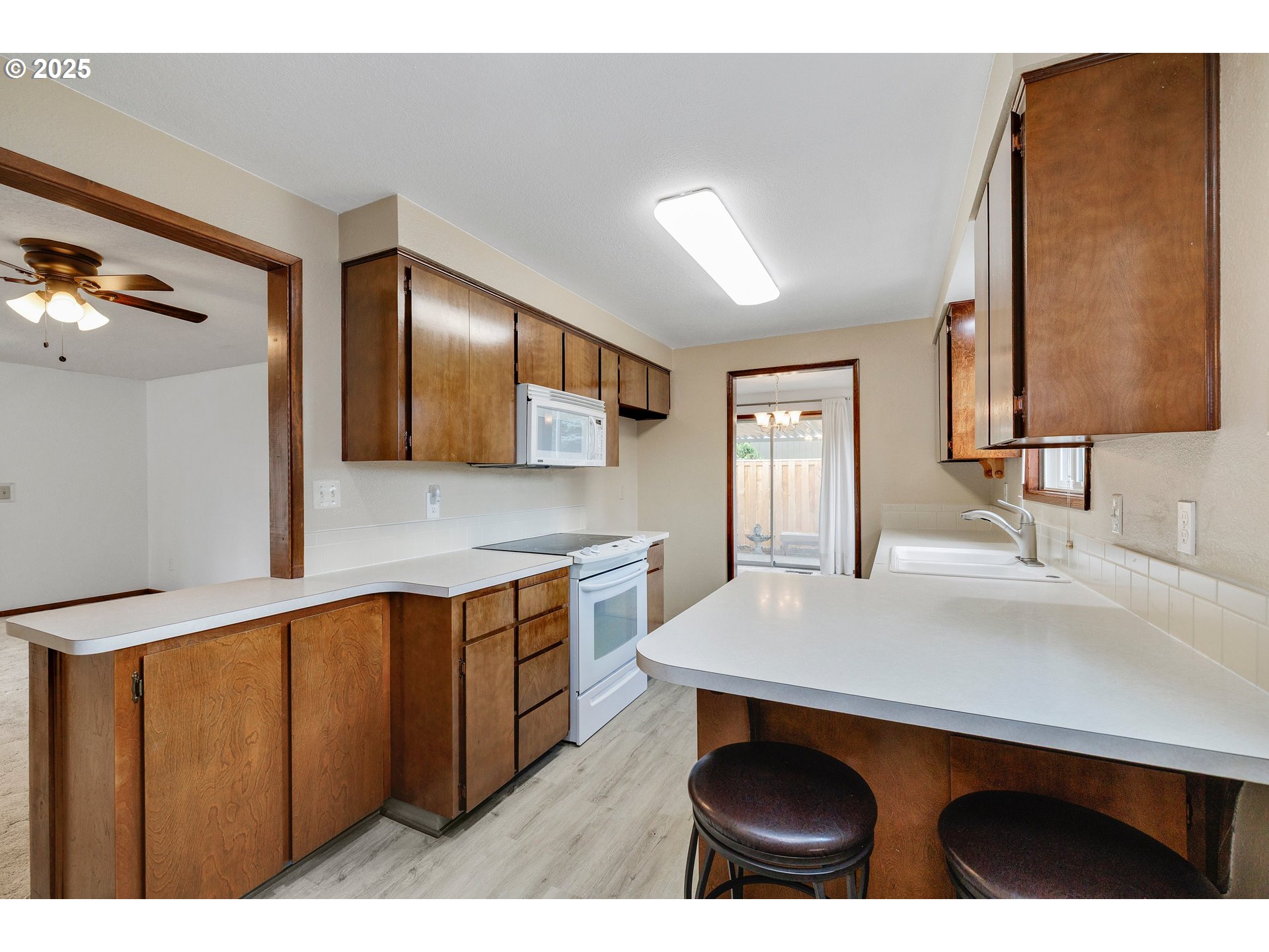 210 Forest Place Forest Grove, OR 97116 - Photo 26 of 35 a kitchen with stainless steel appliances a sink and a refrigerator