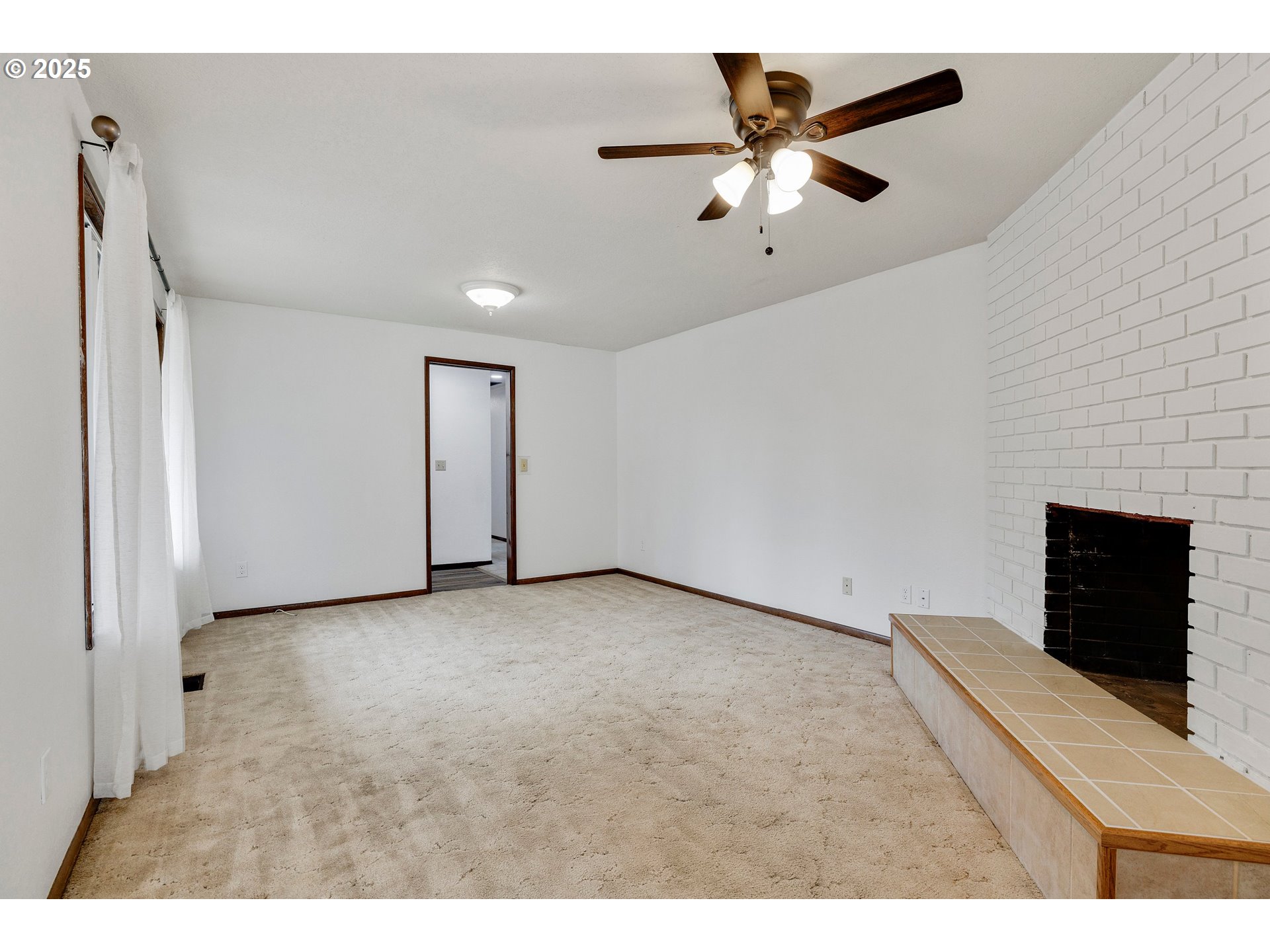 210 Forest Place Forest Grove, OR 97116 - Photo 27 of 35 a view of an empty room with a ceiling fan