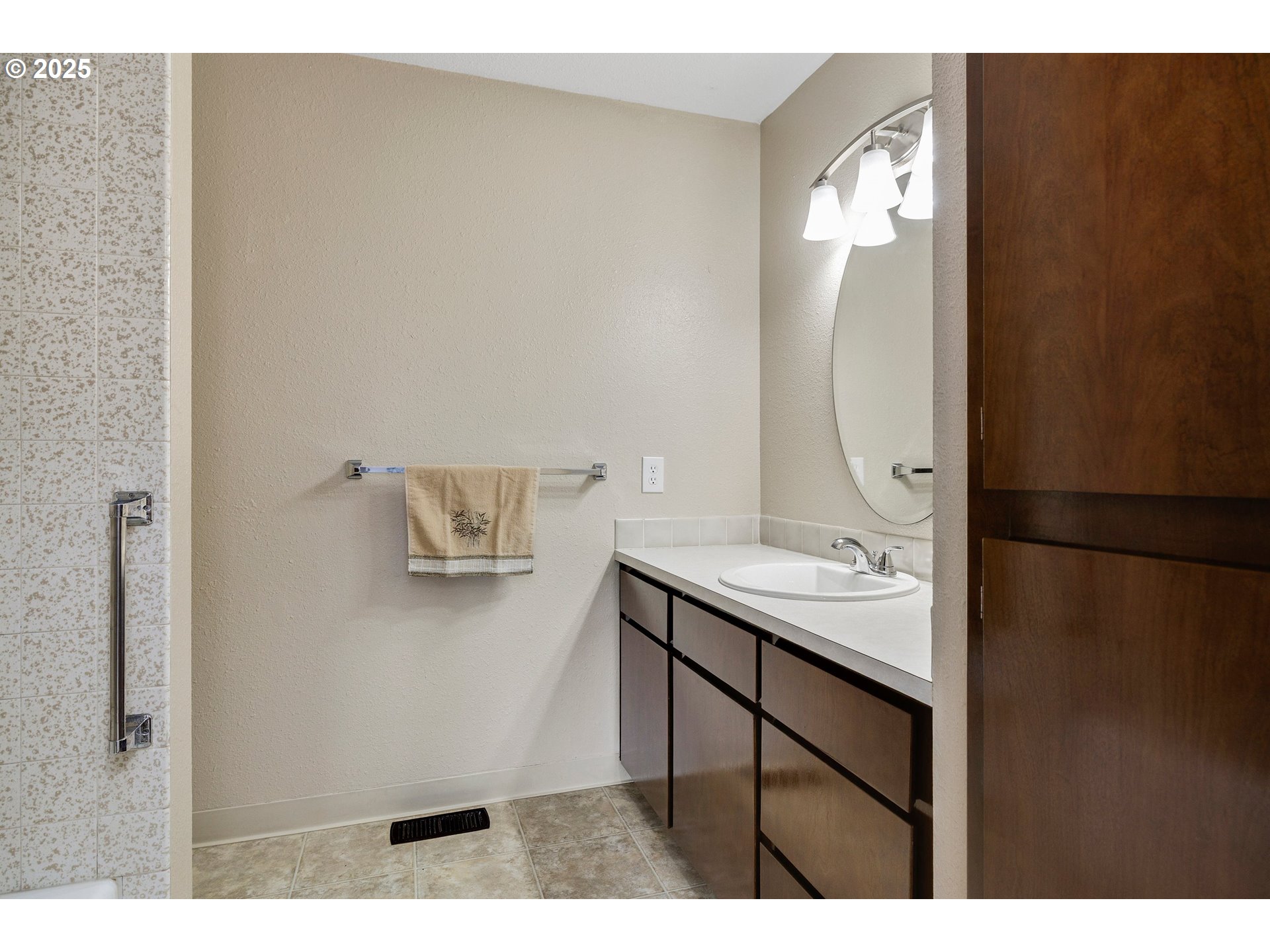 210 Forest Place Forest Grove, OR 97116 - Photo 30 of 35 a bathroom with a sink and mirror