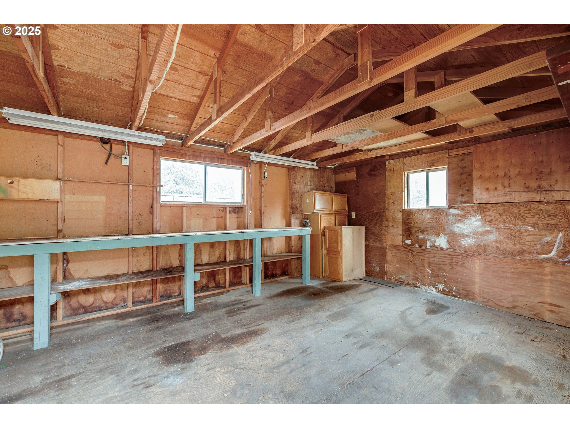 210 Forest Place Forest Grove, OR 97116 - Photo 9 of 35 a view of an empty room with wooden ceiling