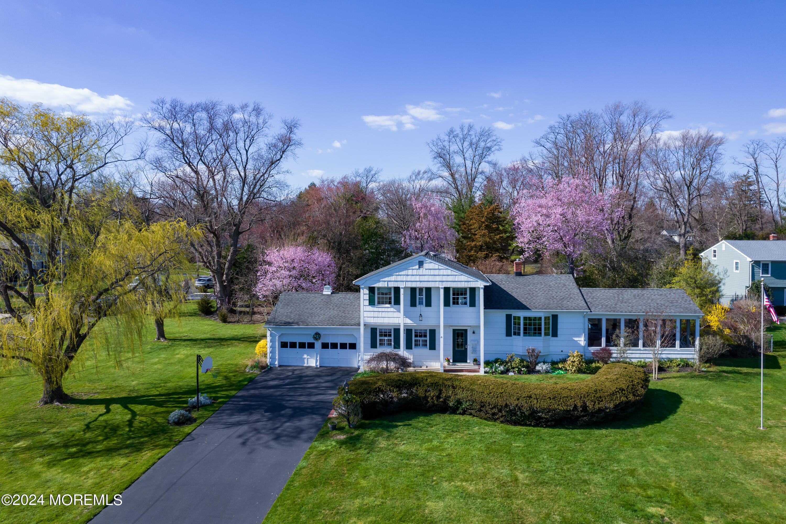 21 Rivers Edge Drive Little Silver, NJ 07739 - Photo 1 of 56 a front view of a house with a garden