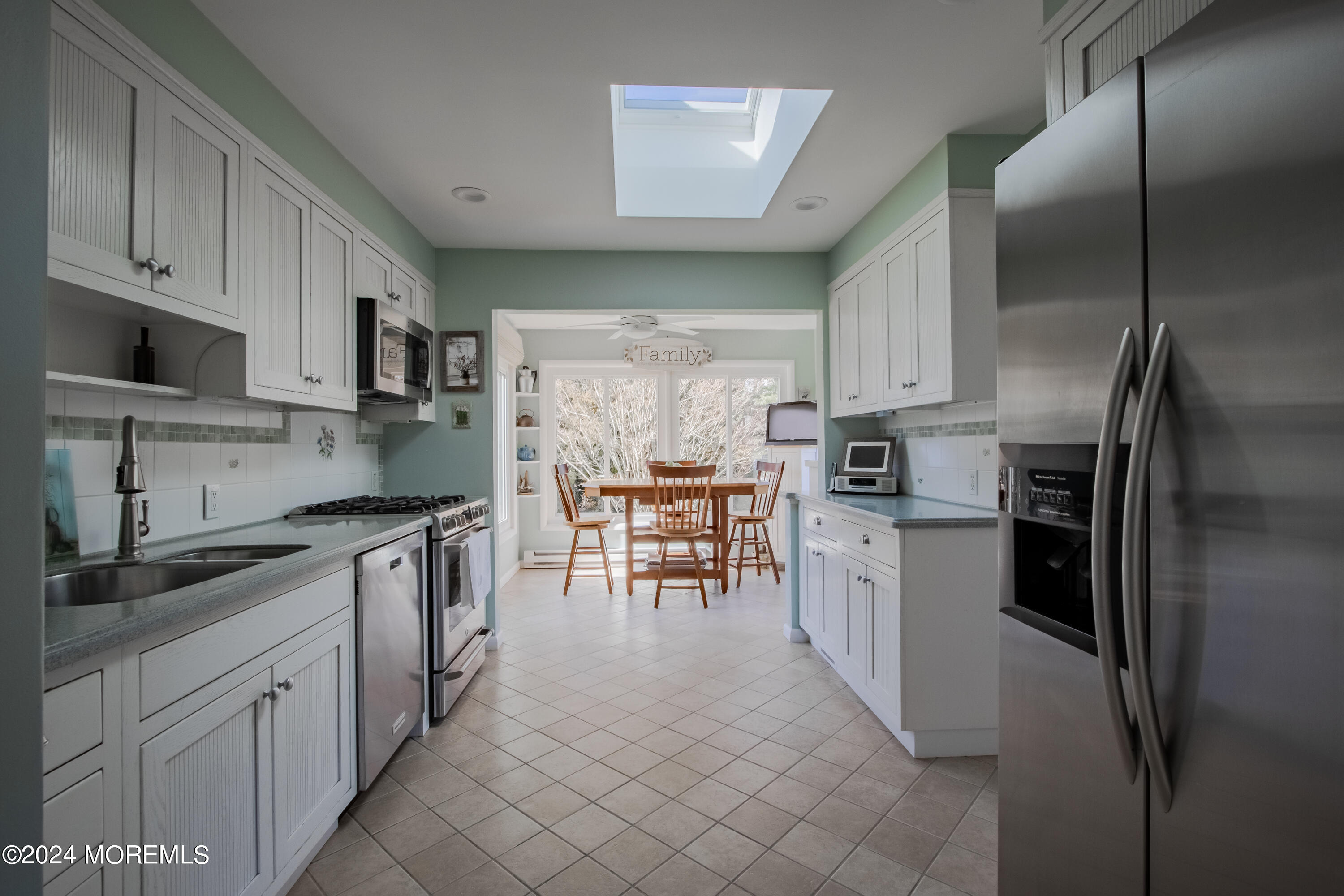 21 Rivers Edge Drive Little Silver, NJ 07739 - Photo 11 of 56 a kitchen with stainless steel appliances a refrigerator sink and cabinets