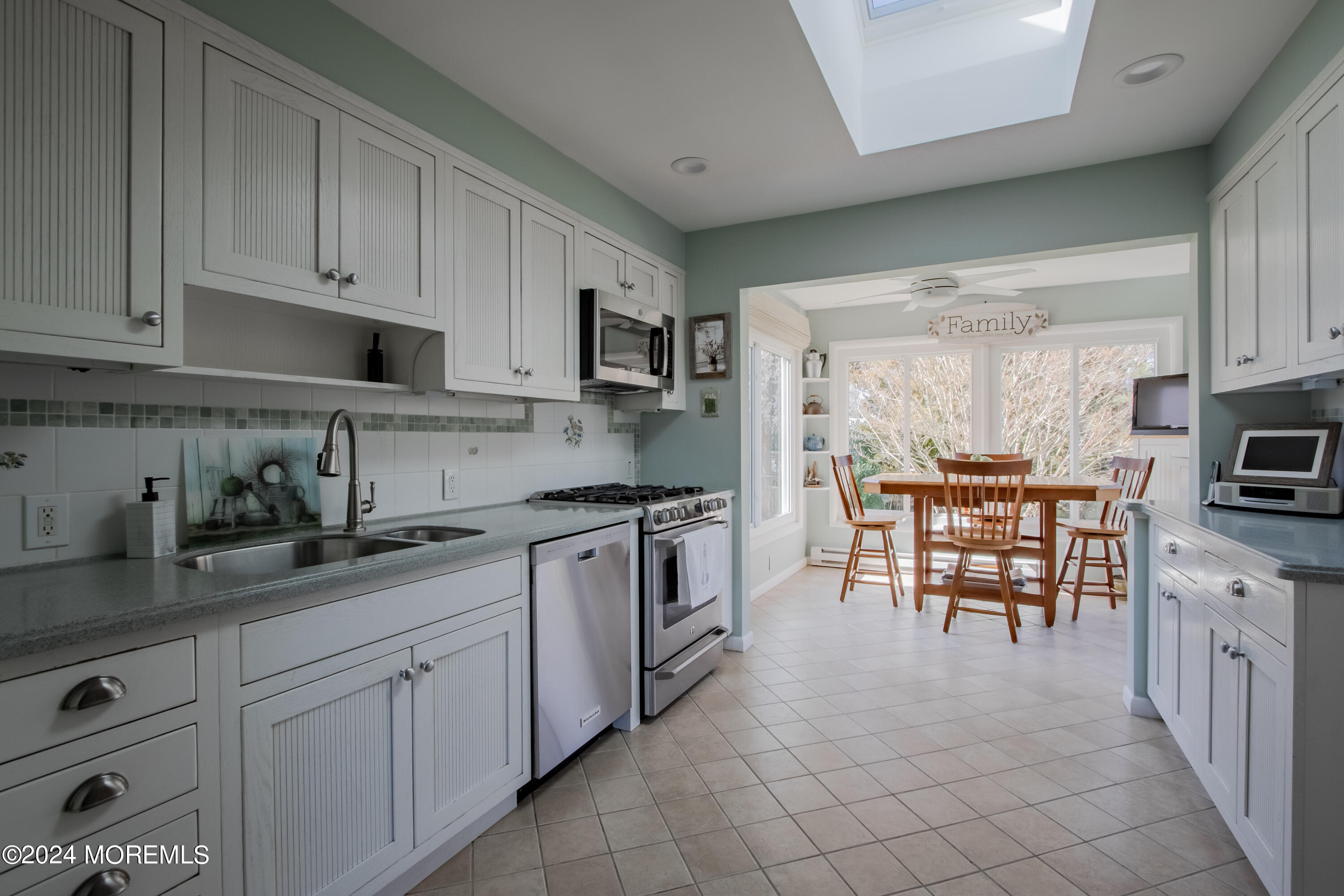 21 Rivers Edge Drive Little Silver, NJ 07739 - Photo 12 of 56 a kitchen with granite countertop white cabinets and stainless steel appliances