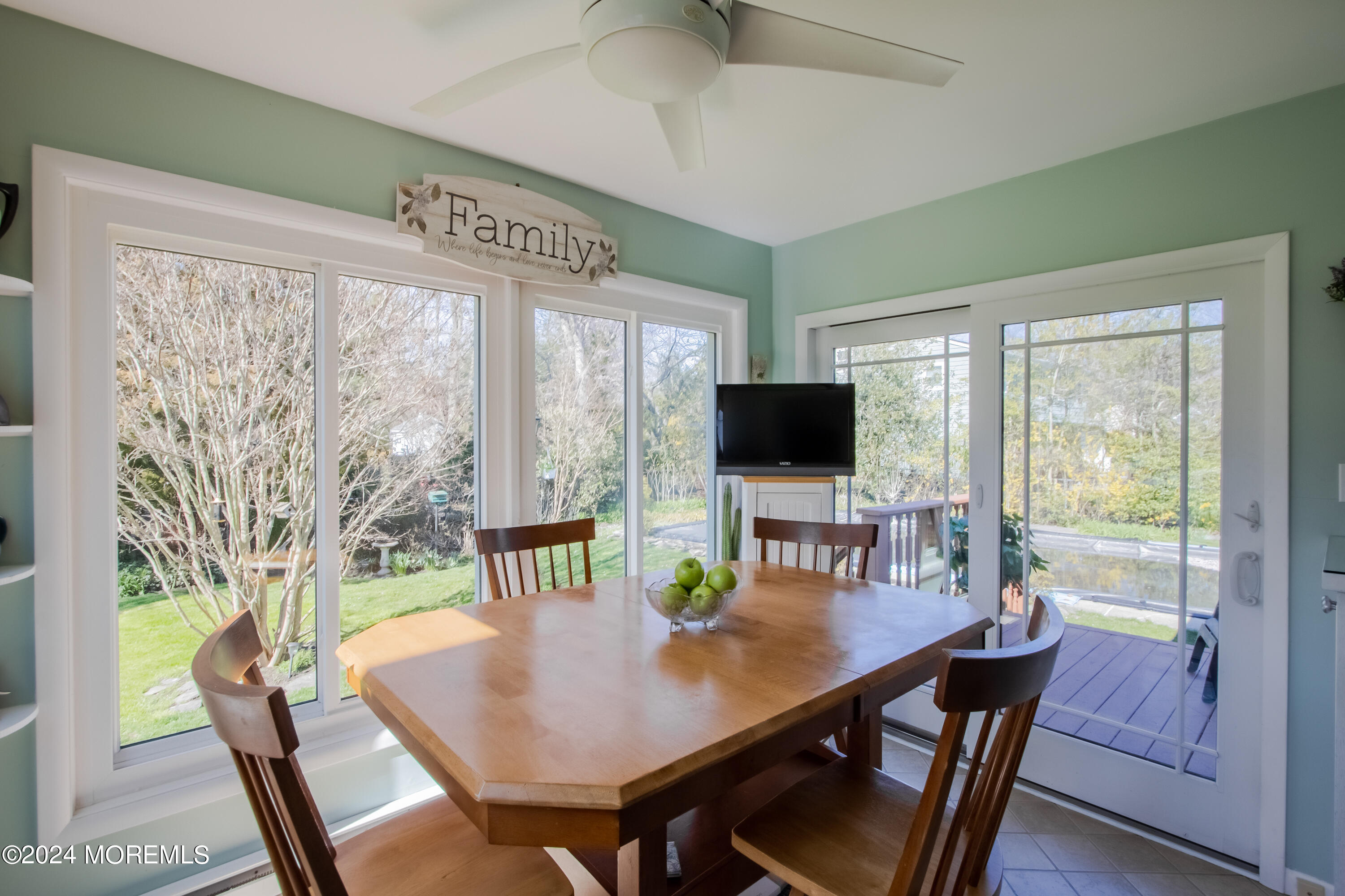 21 Rivers Edge Drive Little Silver, NJ 07739 - Photo 15 of 56 a view of a dining room with furniture window and wooden floor