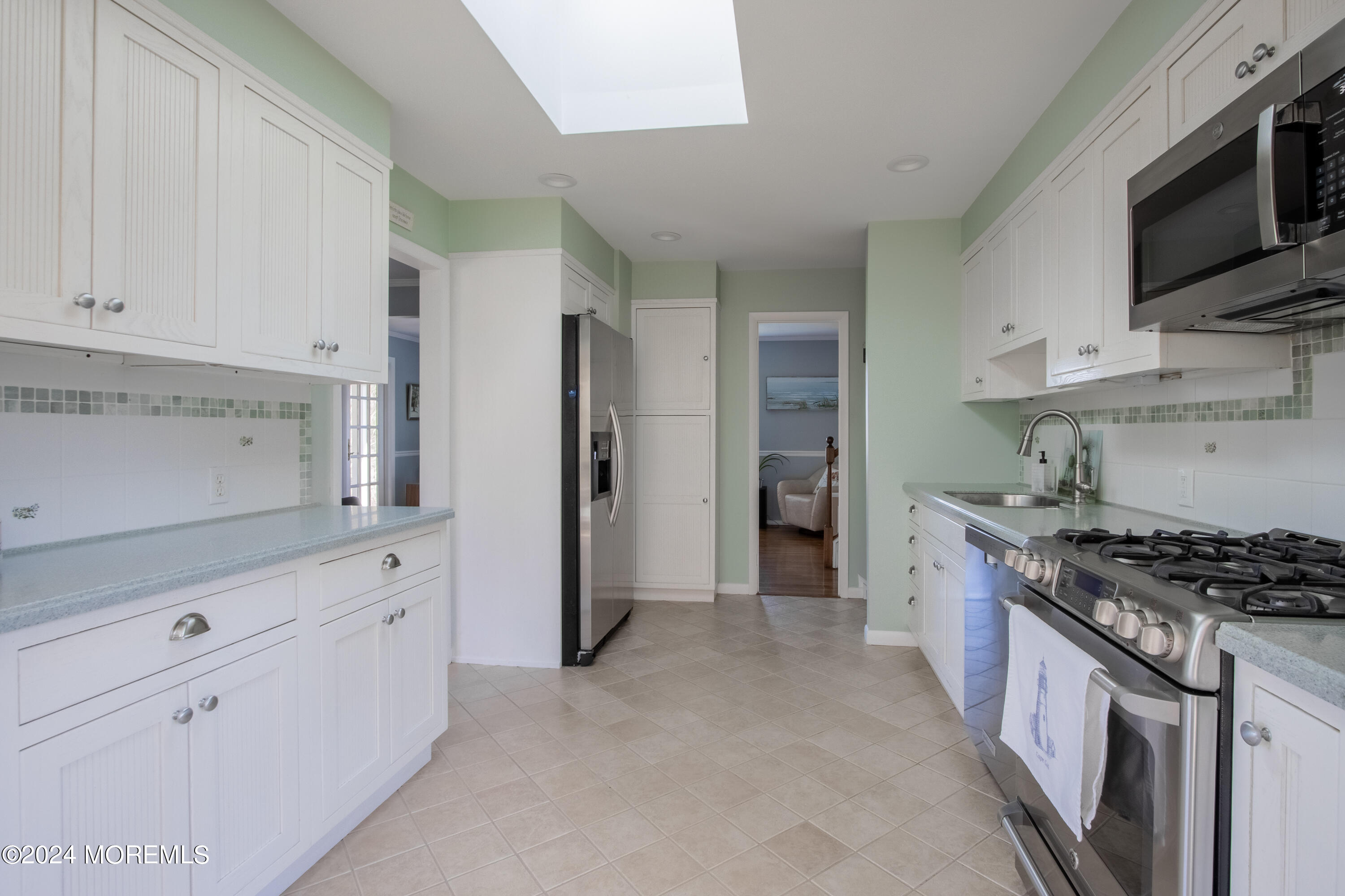 21 Rivers Edge Drive Little Silver, NJ 07739 - Photo 16 of 56 a kitchen with stainless steel appliances a refrigerator stove and sink