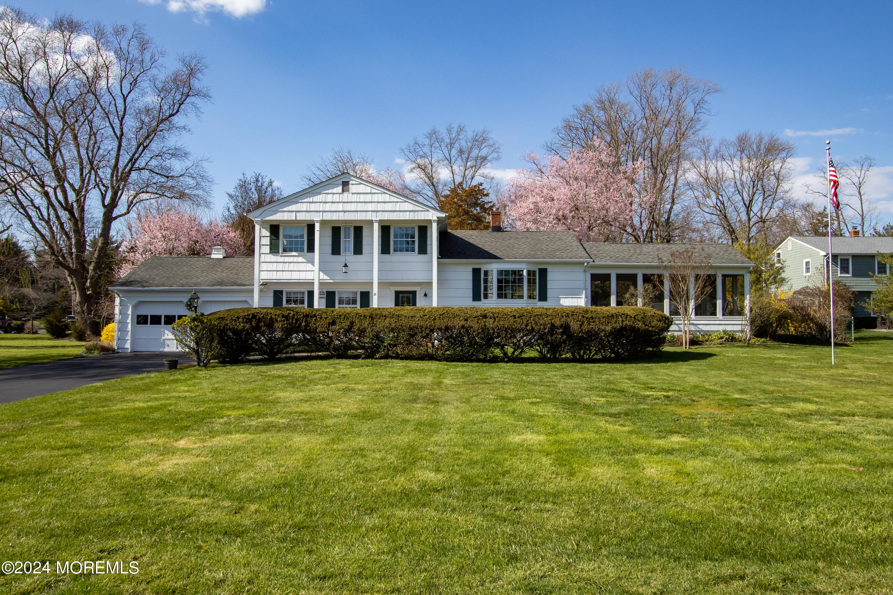 21 Rivers Edge Drive Little Silver, NJ 07739 - Photo 2 of 56 a front view of a house with a garden