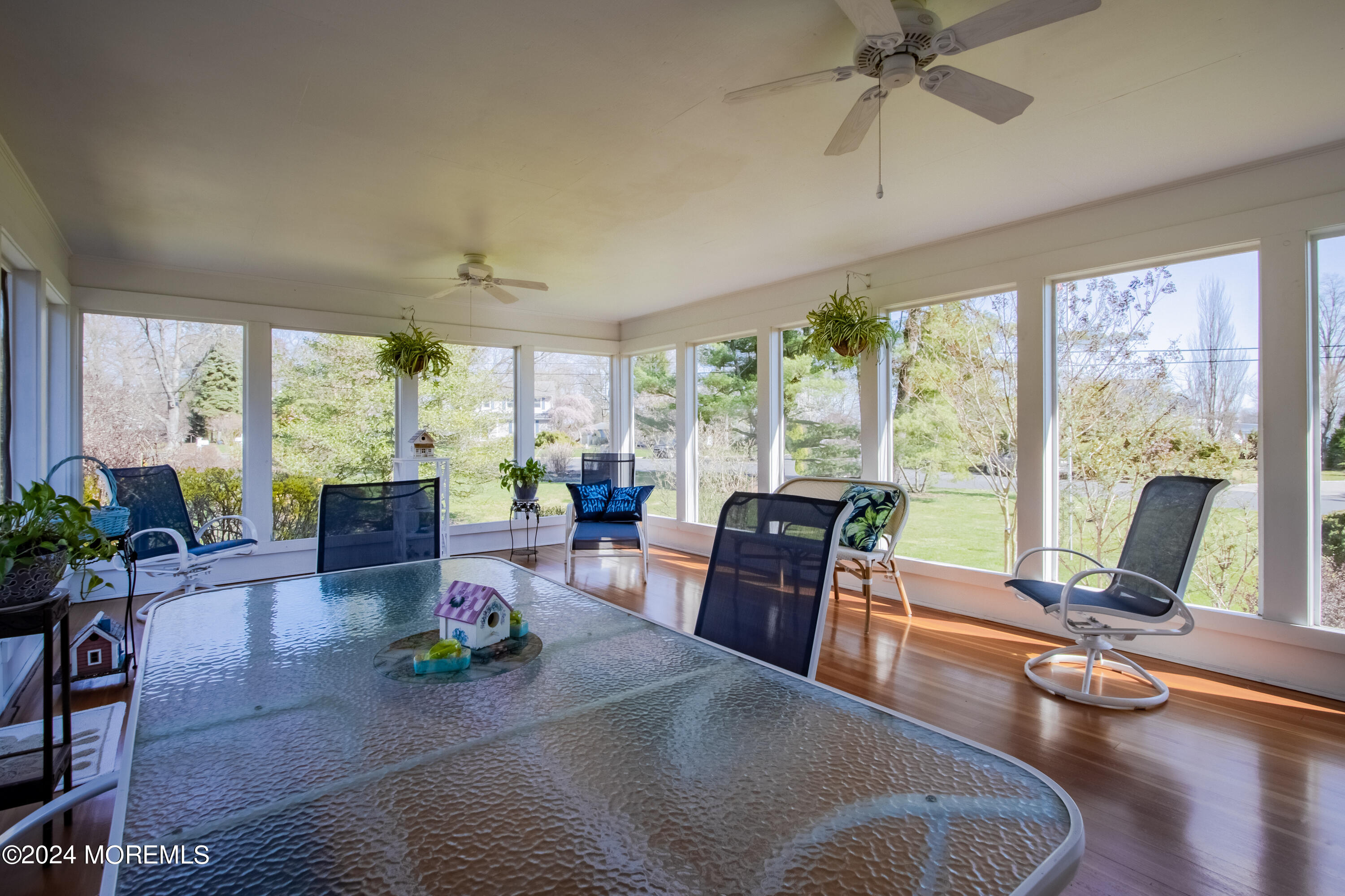 21 Rivers Edge Drive Little Silver, NJ 07739 - Photo 21 of 56 a living room with furniture and floor to ceiling windows