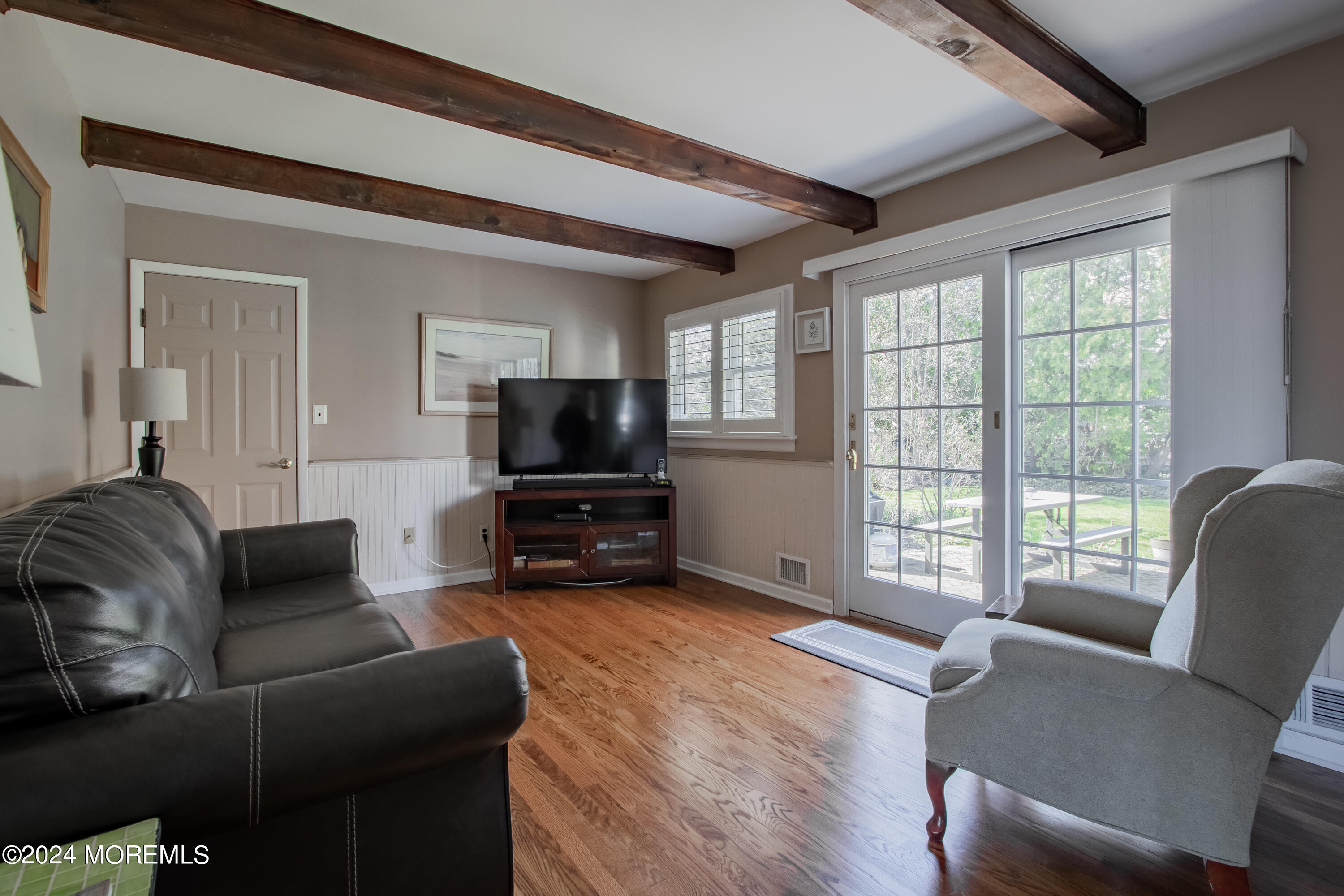21 Rivers Edge Drive Little Silver, NJ 07739 - Photo 22 of 56 a living room with furniture and a flat screen tv