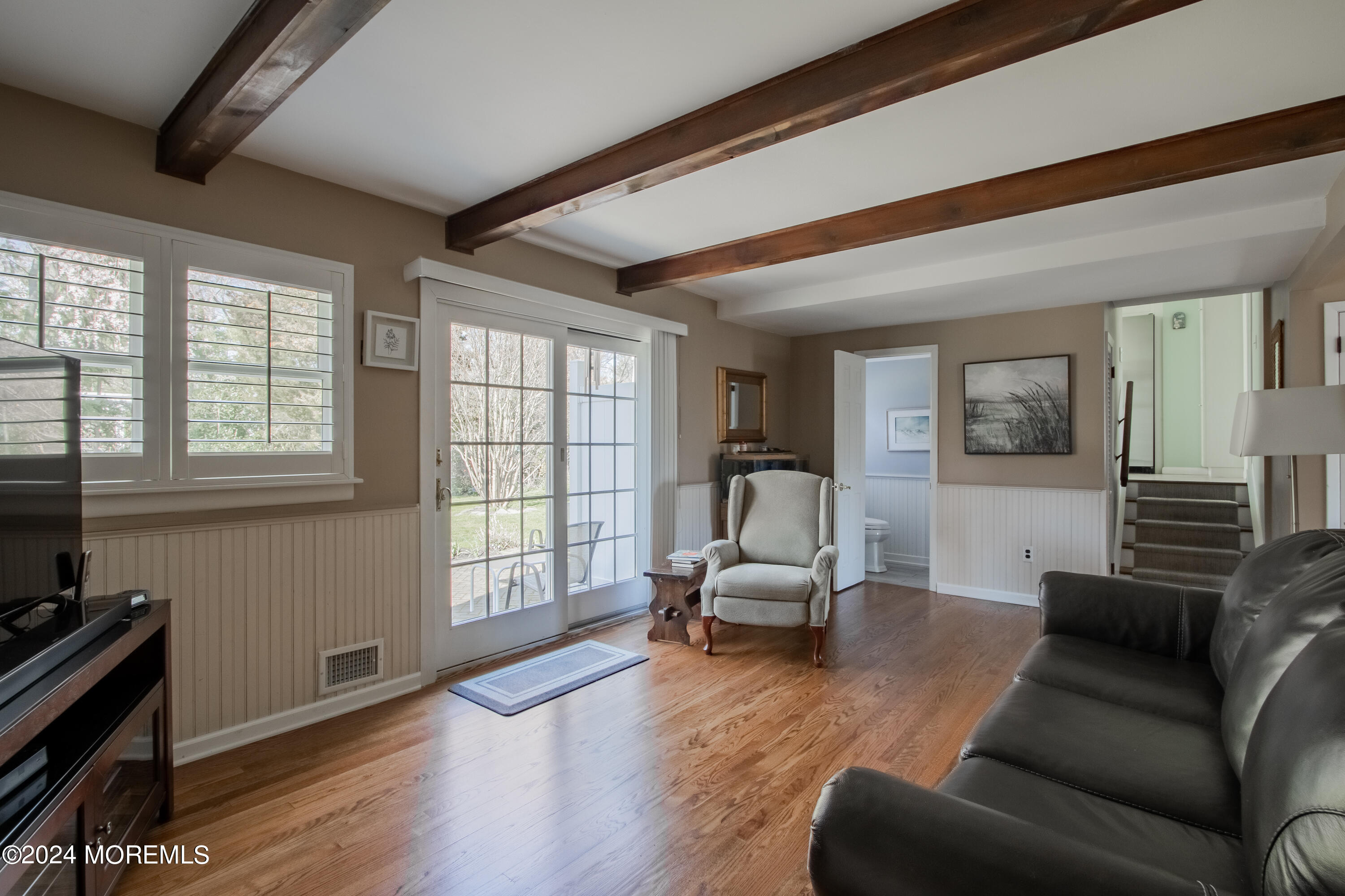 21 Rivers Edge Drive Little Silver, NJ 07739 - Photo 23 of 56 a living room with furniture and a flat screen tv