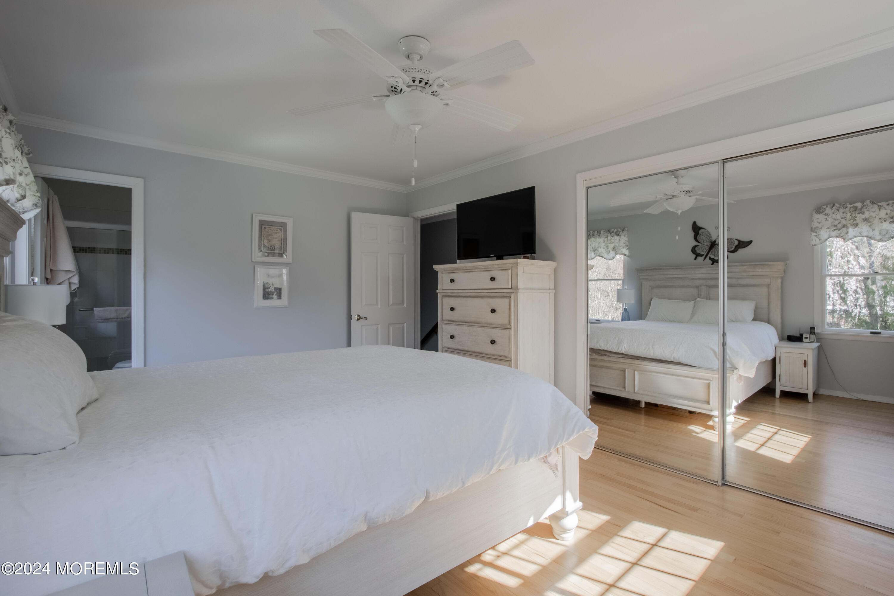 21 Rivers Edge Drive Little Silver, NJ 07739 - Photo 30 of 56 a bedroom with a bed and a view of living room