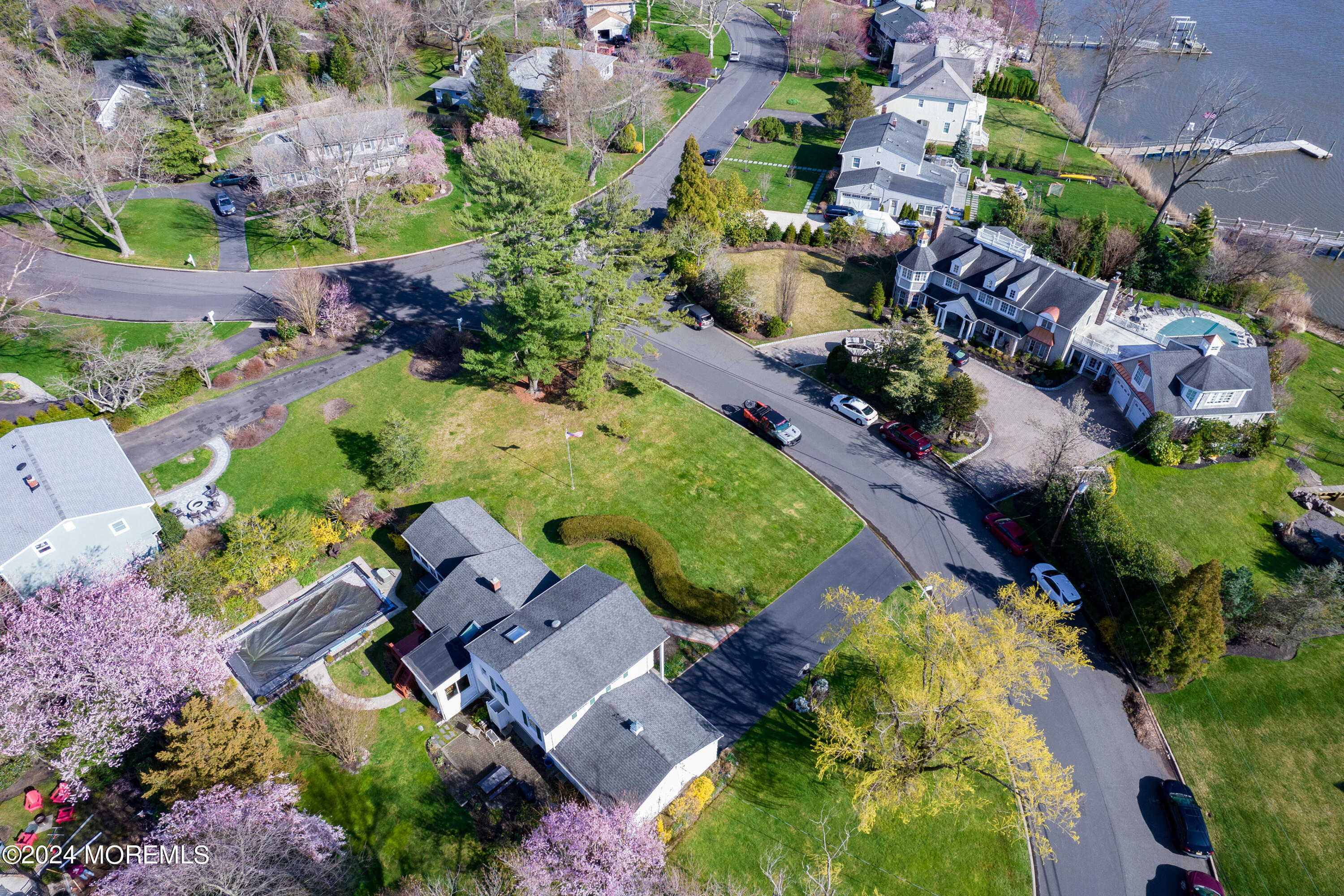 21 Rivers Edge Drive Little Silver, NJ 07739 - Photo 3 of 56 an aerial view of a house with a garden and swimming pool