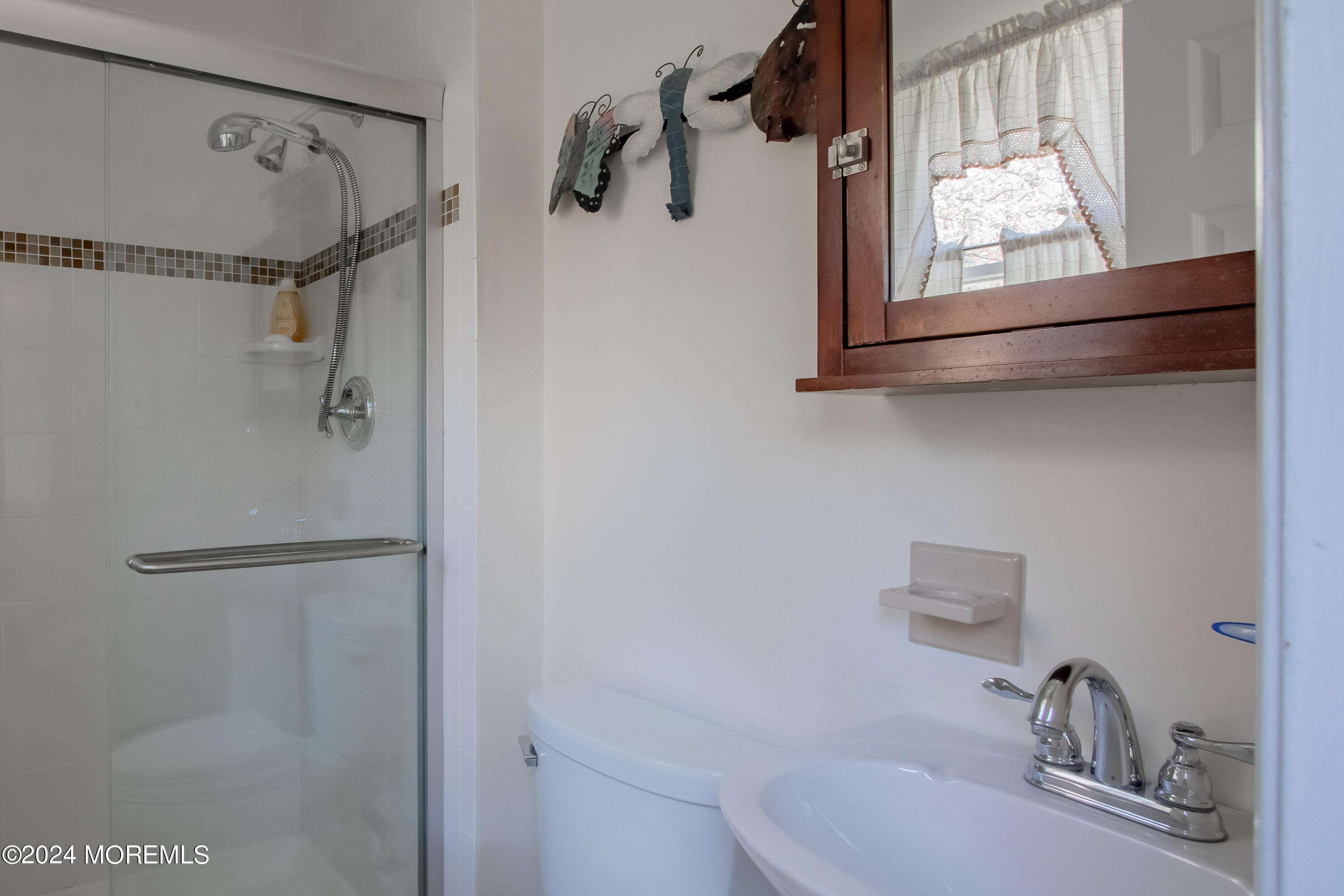 21 Rivers Edge Drive Little Silver, NJ 07739 - Photo 32 of 56 a bathroom with a sink and mirror