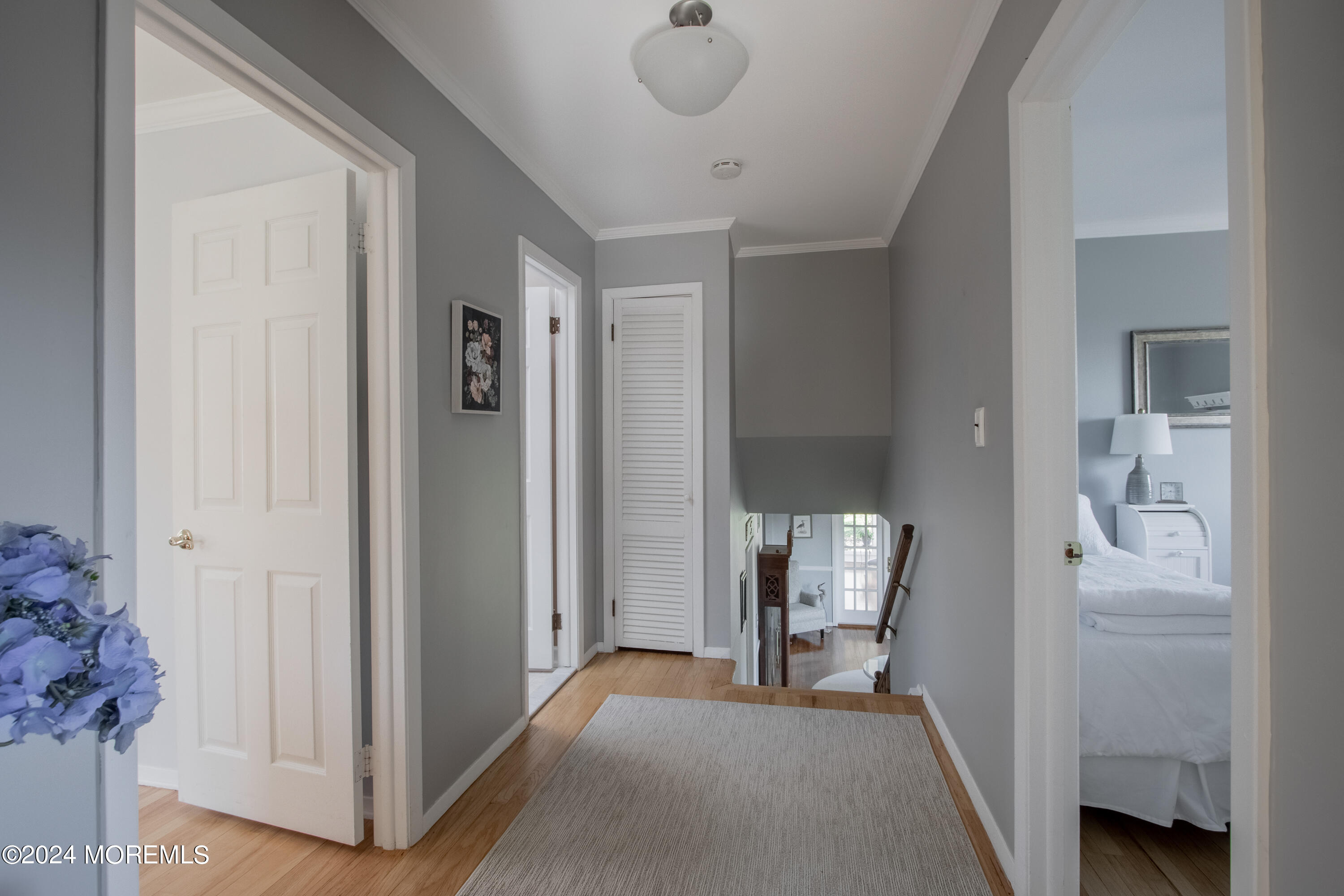 21 Rivers Edge Drive Little Silver, NJ 07739 - Photo 35 of 56 a view of a room that has a bed and a chair in it