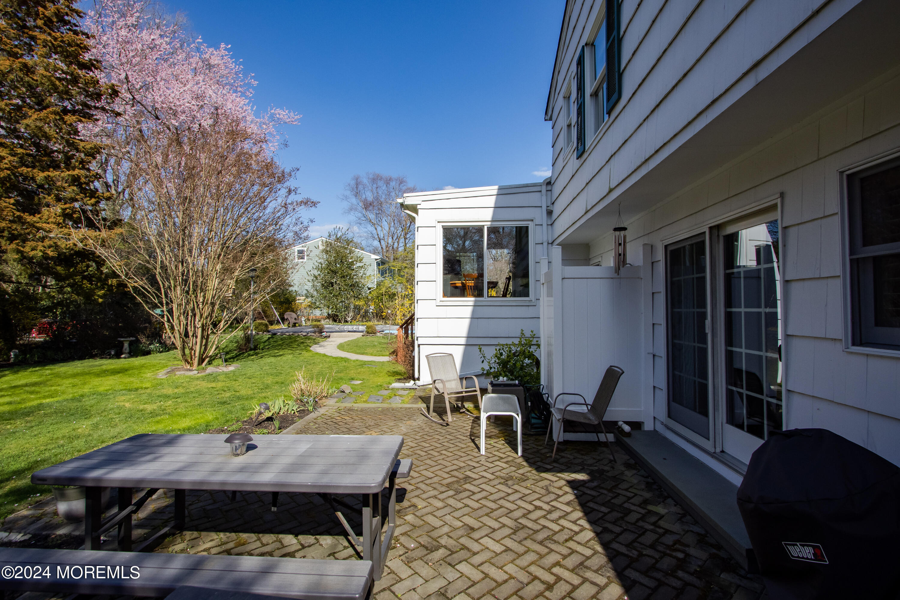 21 Rivers Edge Drive Little Silver, NJ 07739 - Photo 37 of 56 a view of backyard of house with yard barbeque oven and outdoor seating