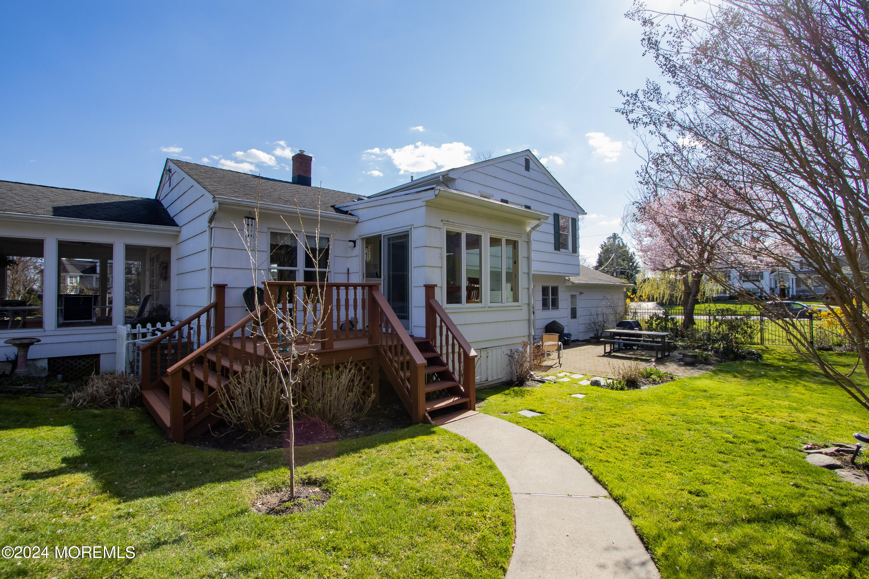 21 Rivers Edge Drive Little Silver, NJ 07739 - Photo 41 of 56 a view of a house with a yard patio and fire pit