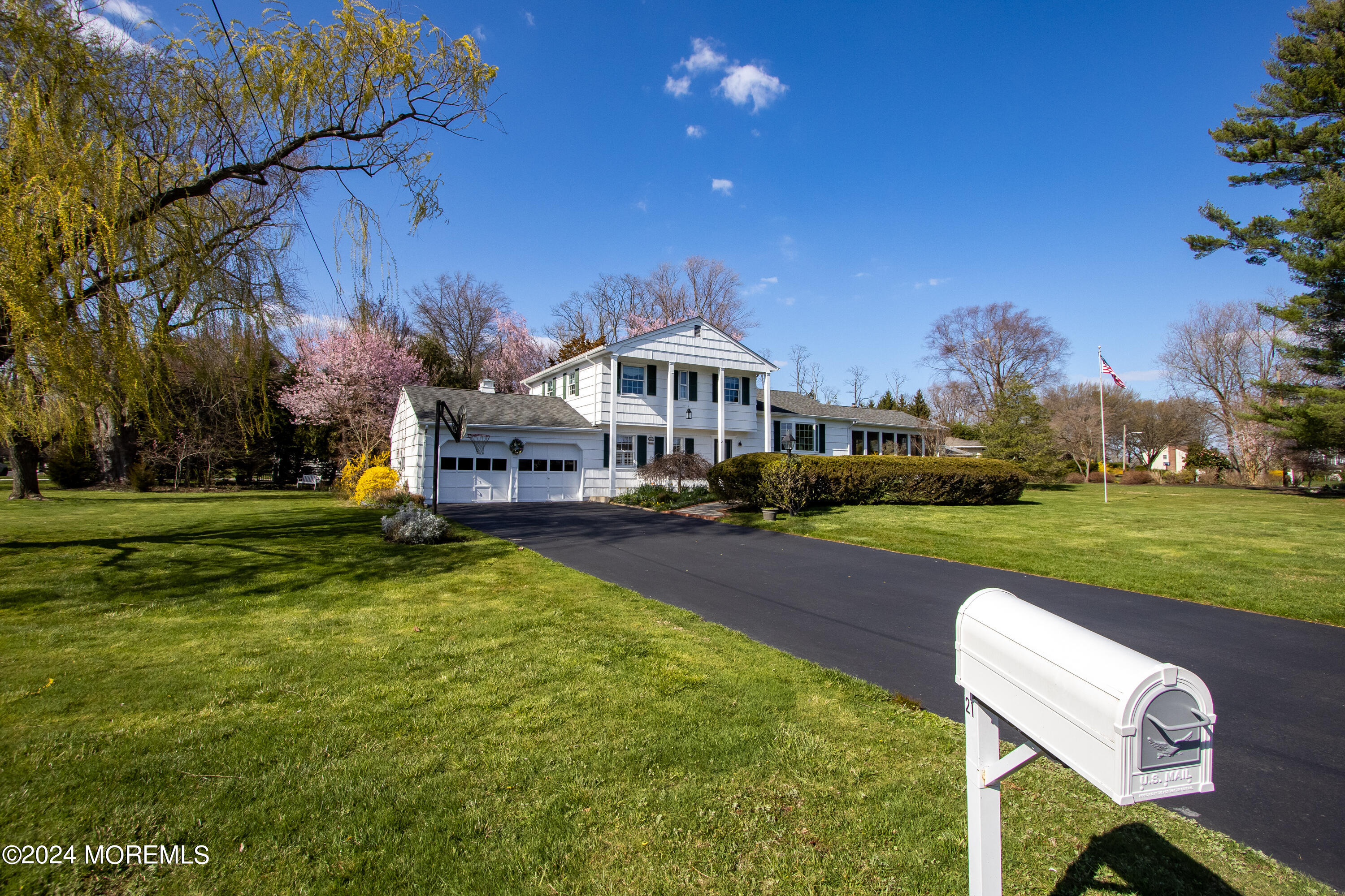 21 Rivers Edge Drive Little Silver, NJ 07739 - Photo 44 of 56 a front view of a house with garden