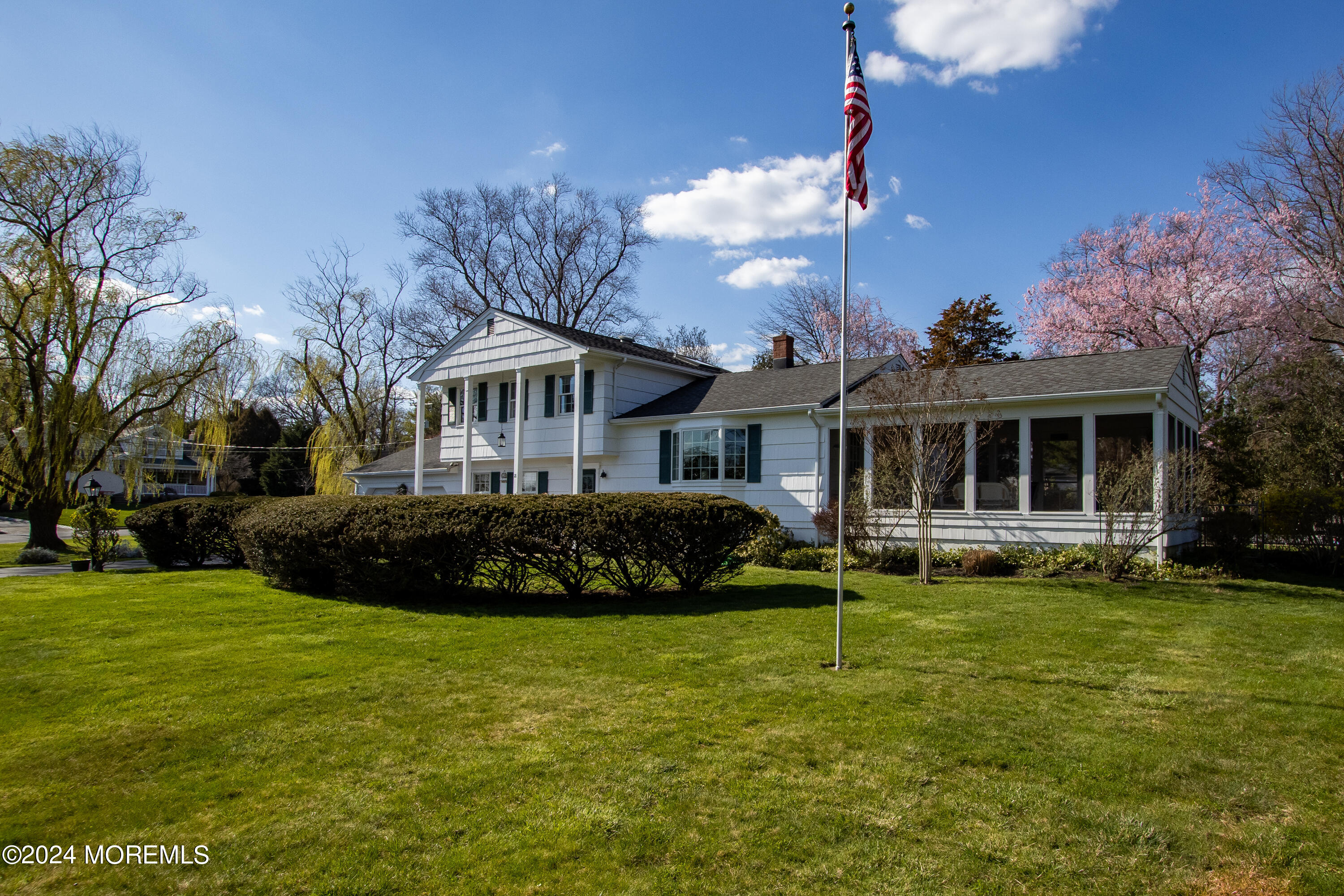 21 Rivers Edge Drive Little Silver, NJ 07739 - Photo 46 of 56 a front view of a house with a garden