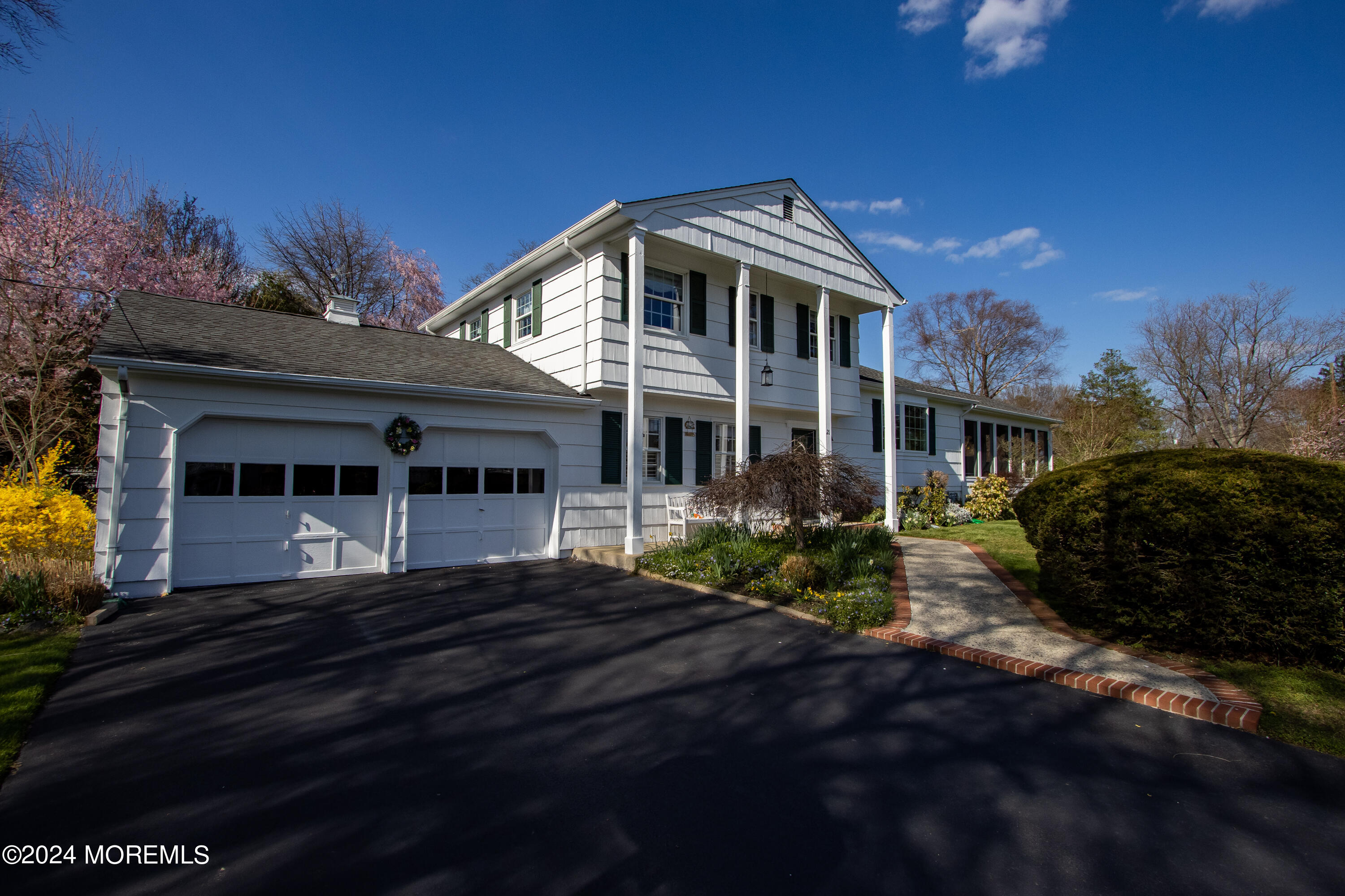 21 Rivers Edge Drive Little Silver, NJ 07739 - Photo 47 of 56 a front view of a house with a garden