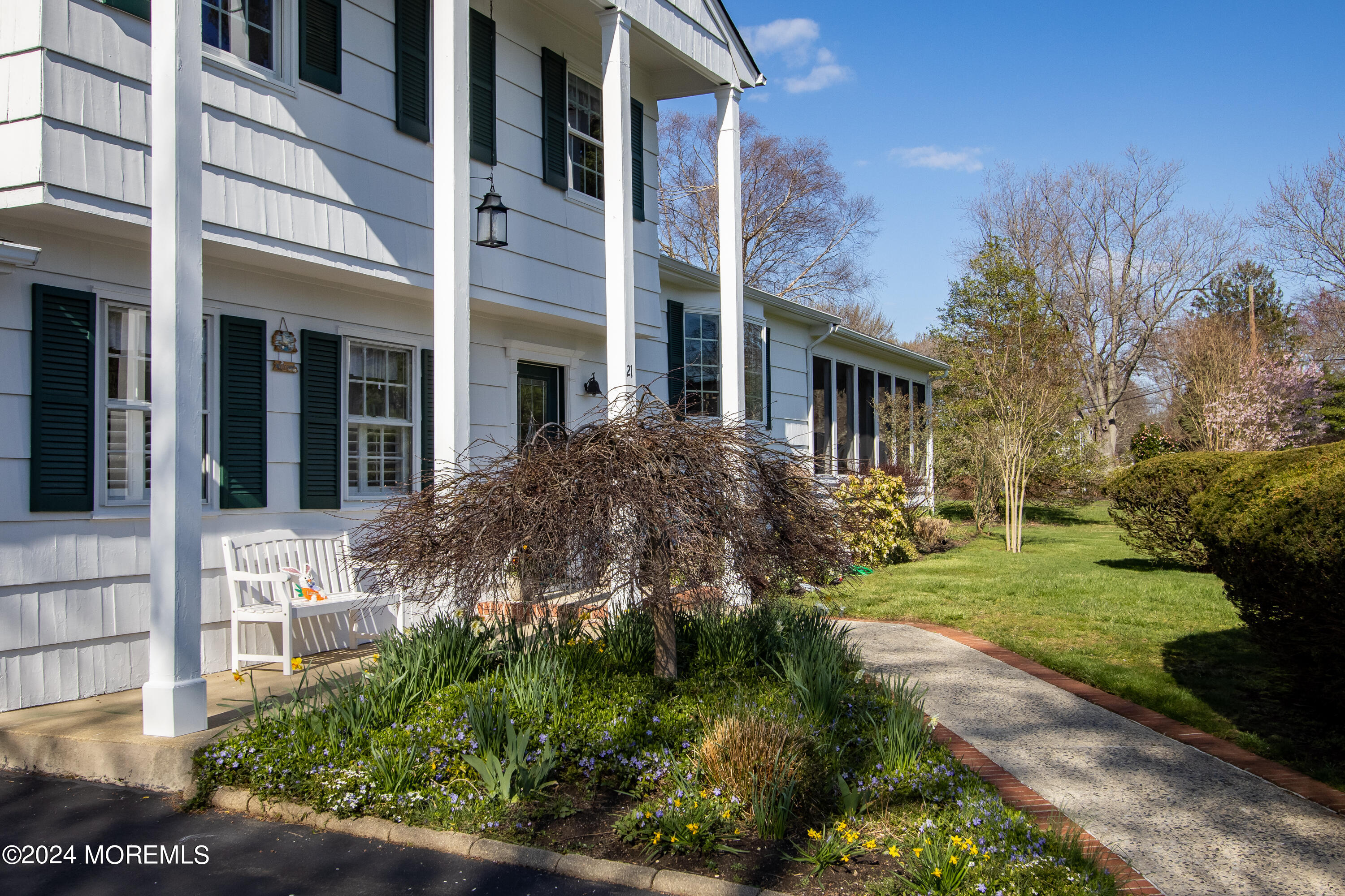 21 Rivers Edge Drive Little Silver, NJ 07739 - Photo 48 of 56 a view of a house with brick walls and a yard with plants