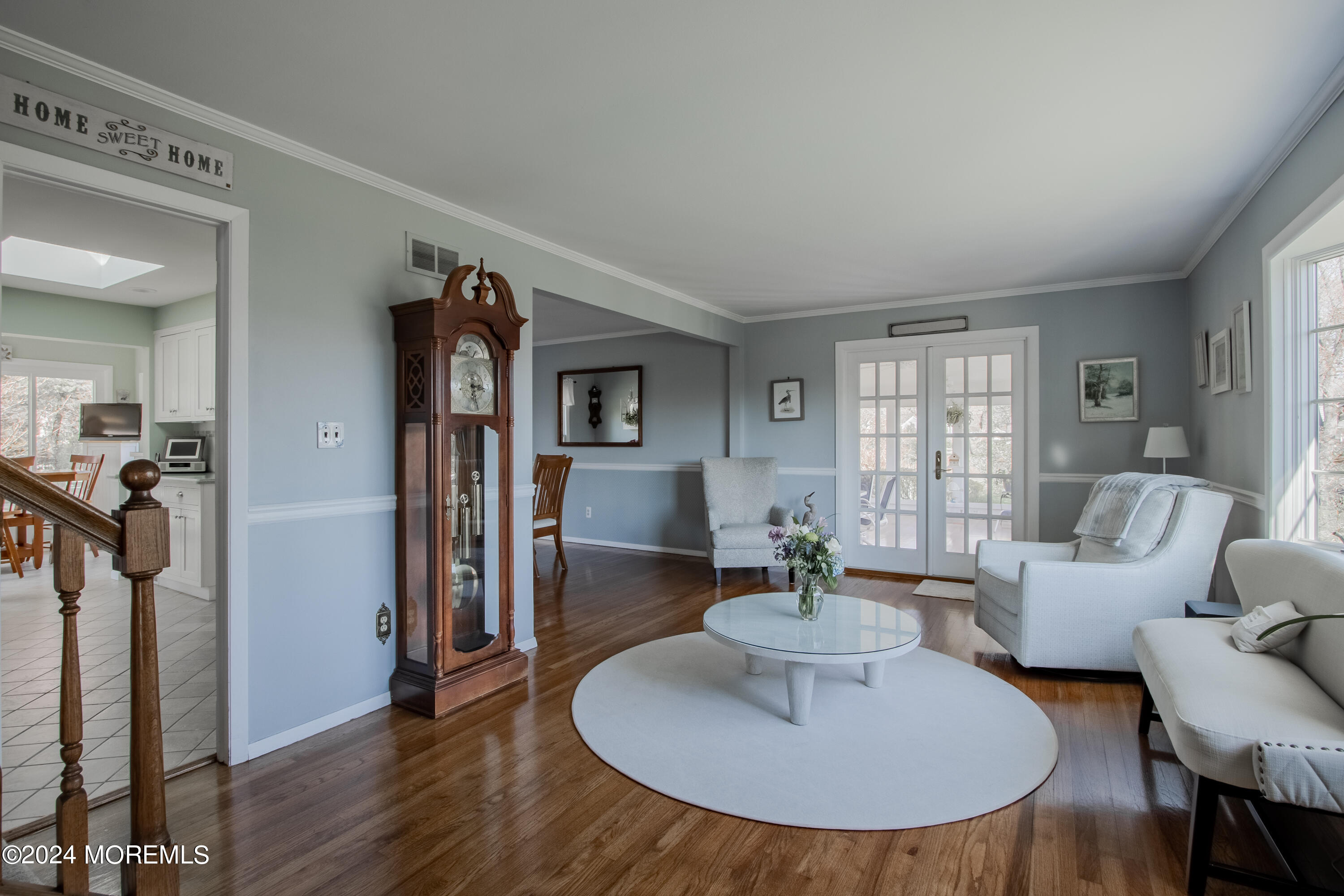 21 Rivers Edge Drive Little Silver, NJ 07739 - Photo 8 of 56 a living room with furniture a large window and a dining table