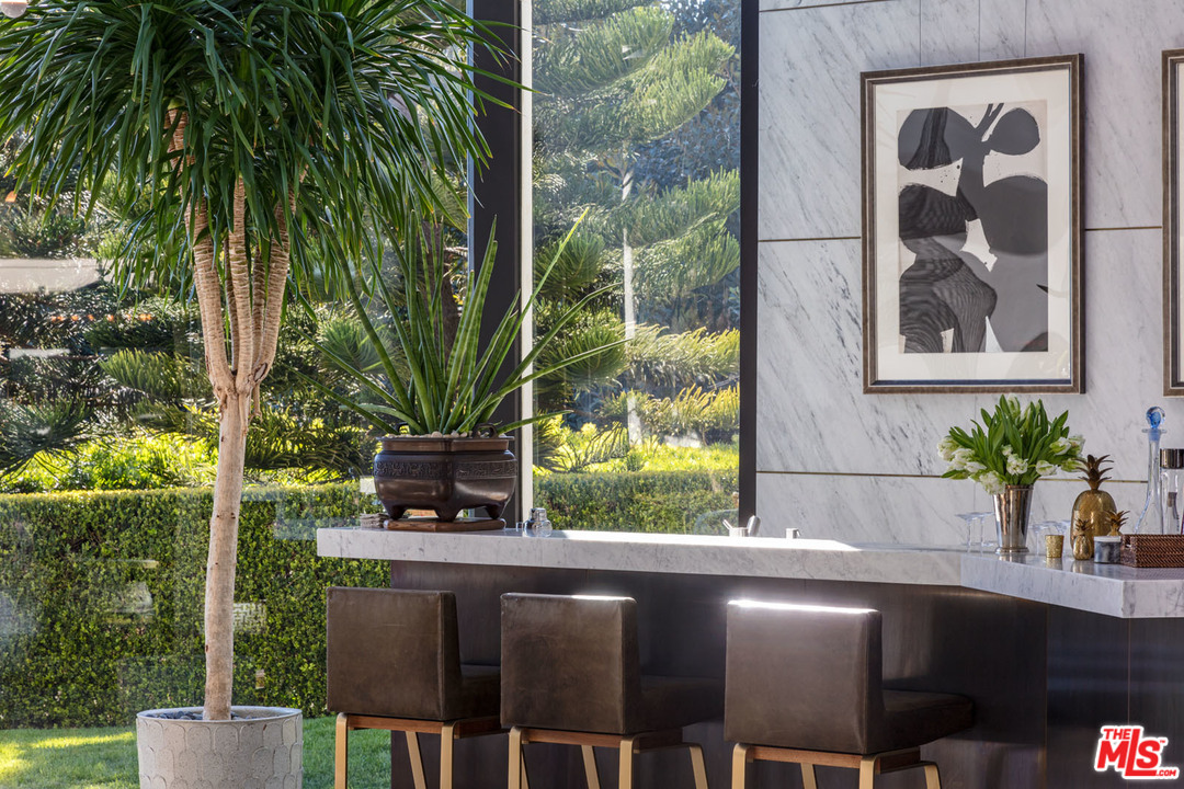 North Hillcrest Road Beverly Hills, CA 90210 - Photo 11 of 34 a kitchen with a sink and wooden floor
