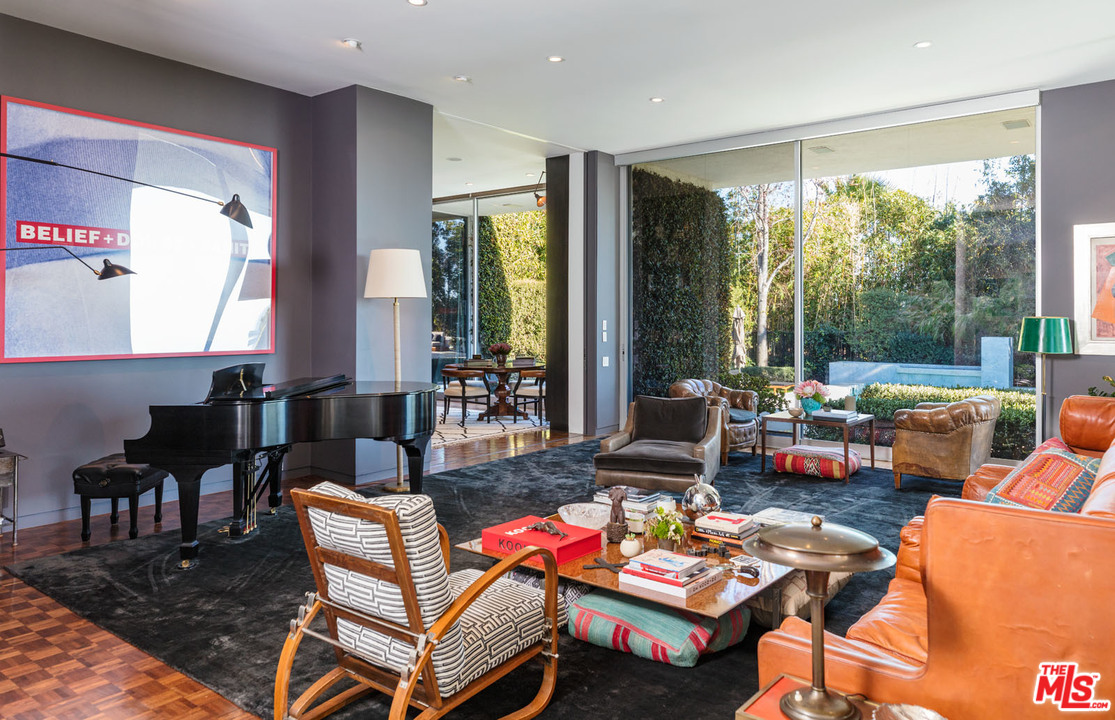 North Hillcrest Road Beverly Hills, CA 90210 - Photo 13 of 34 a living room with fireplace furniture and a large window