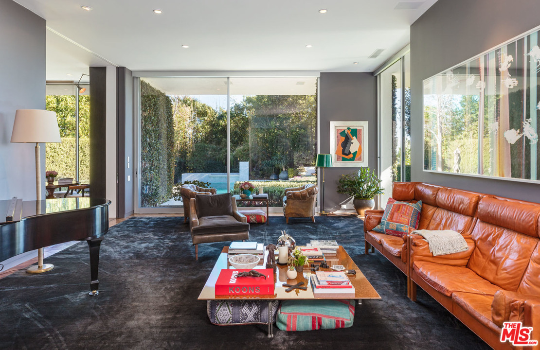 North Hillcrest Road Beverly Hills, CA 90210 - Photo 14 of 34 a living room with furniture a rug and a large window