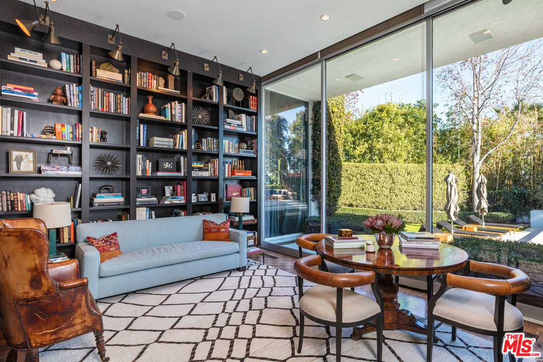North Hillcrest Road Beverly Hills, CA 90210 - Photo 15 of 34 a living room with furniture and a book shelf
