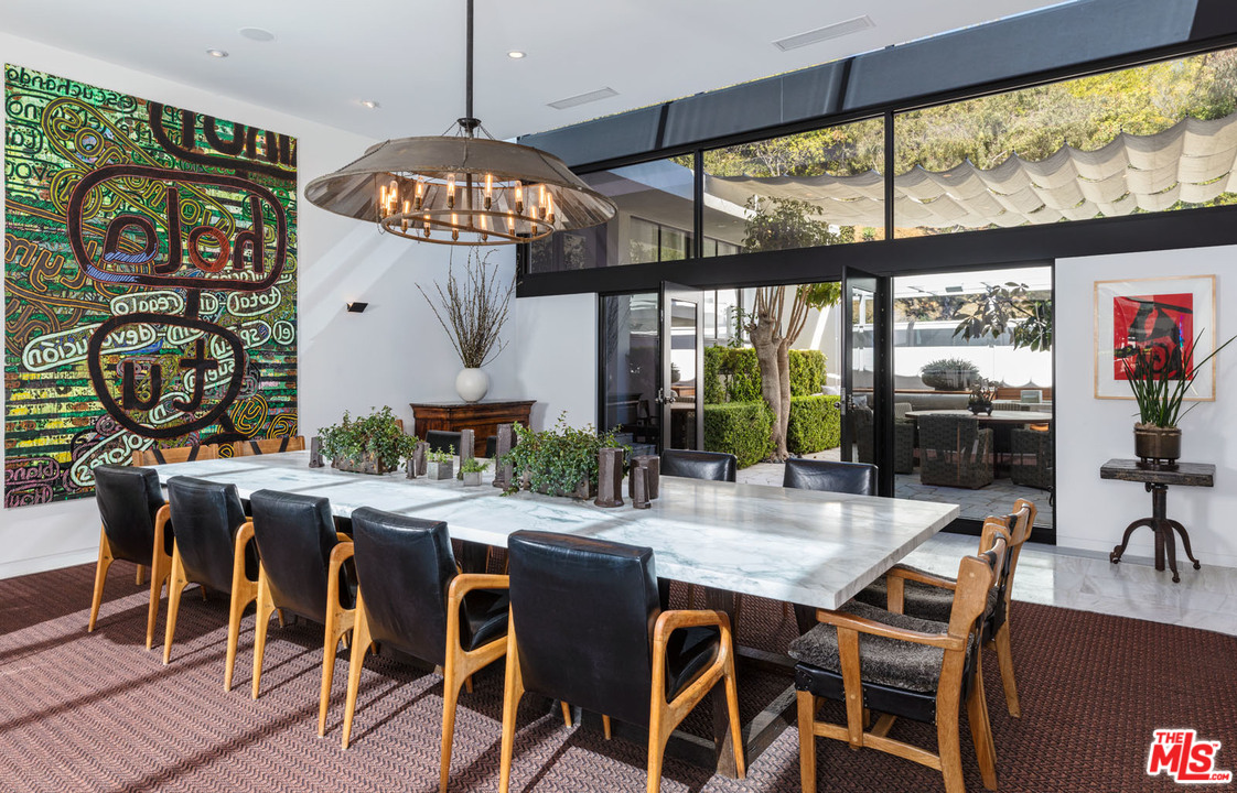 North Hillcrest Road Beverly Hills, CA 90210 - Photo 16 of 34 a view of a dining room with furniture window and outside view