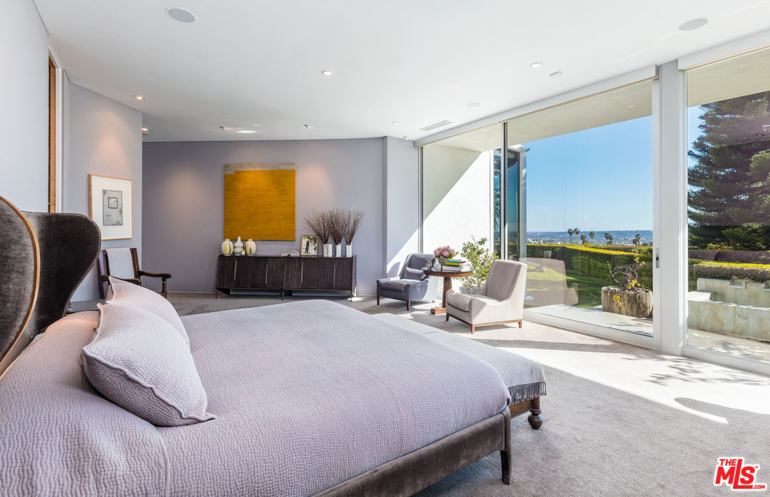 North Hillcrest Road Beverly Hills, CA 90210 - Photo 24 of 34 a bedroom with a bed and window